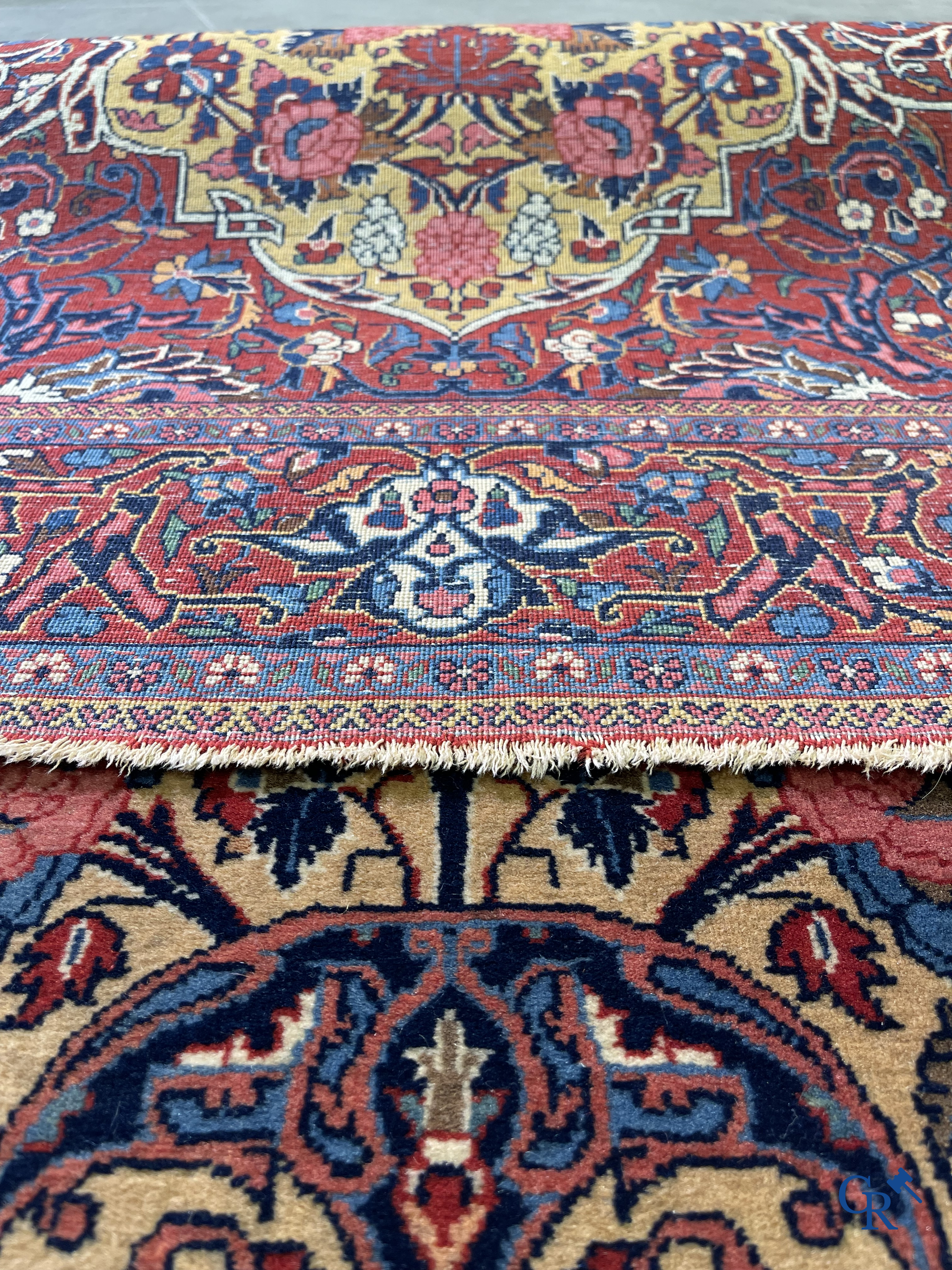 Oriental carpets: Iran. 2 antique hand-knotted Persian carpets with floral decor.