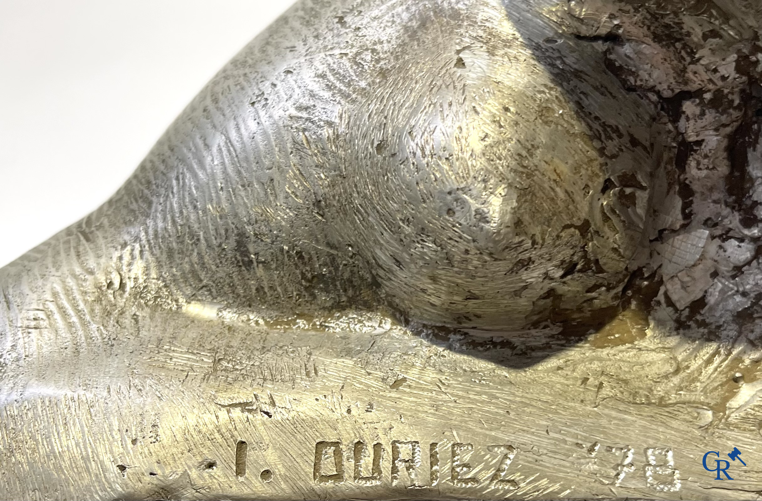 Irénée Duriez, Voorstelling van een liggend naakt in metaallegering. Gesigneerd en gedateerd I. Duriez '78.