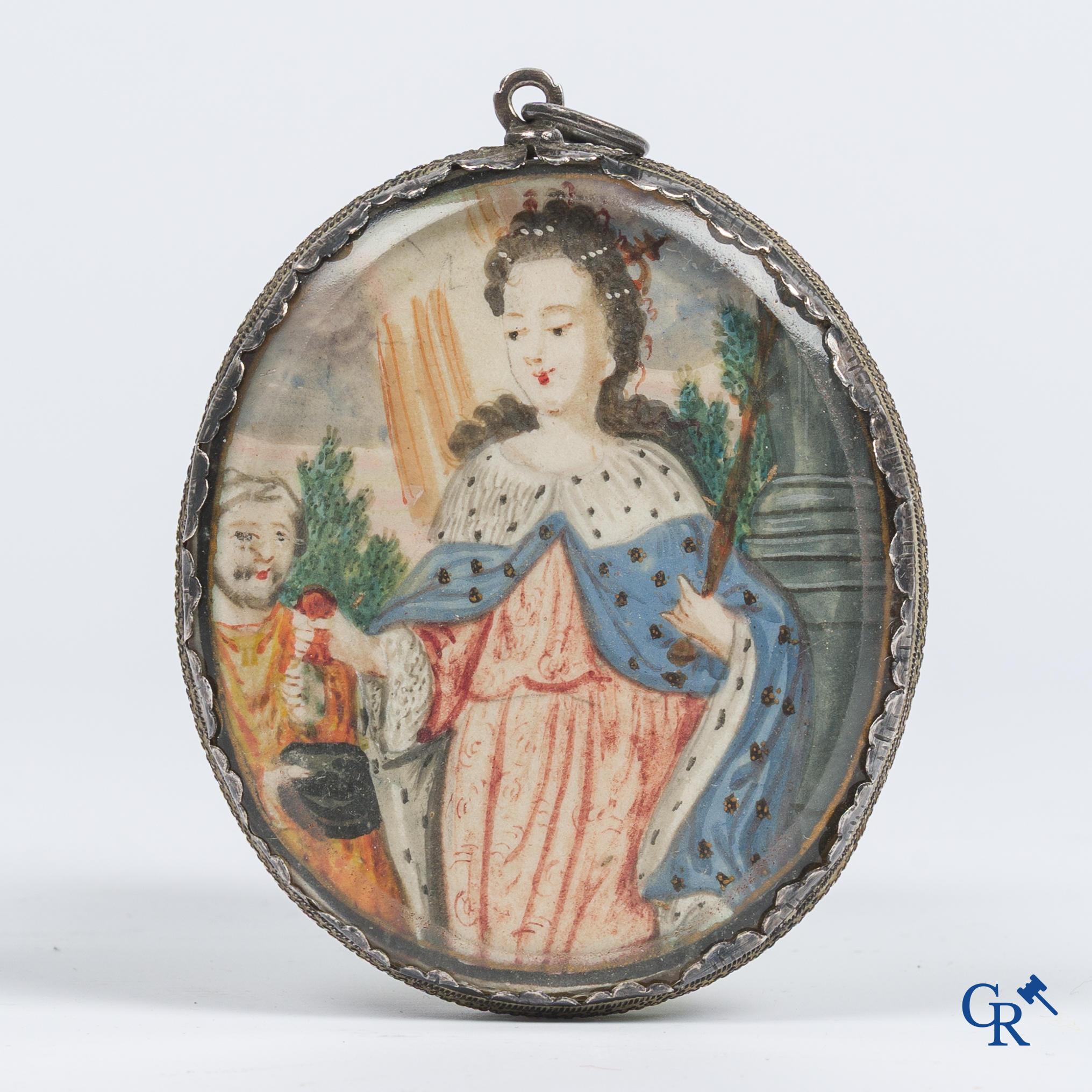 Religieuze objecten. Reliekhanger in zilver montuur met een gouache op perkament en meerdere relikwieën. 18e eeuw.