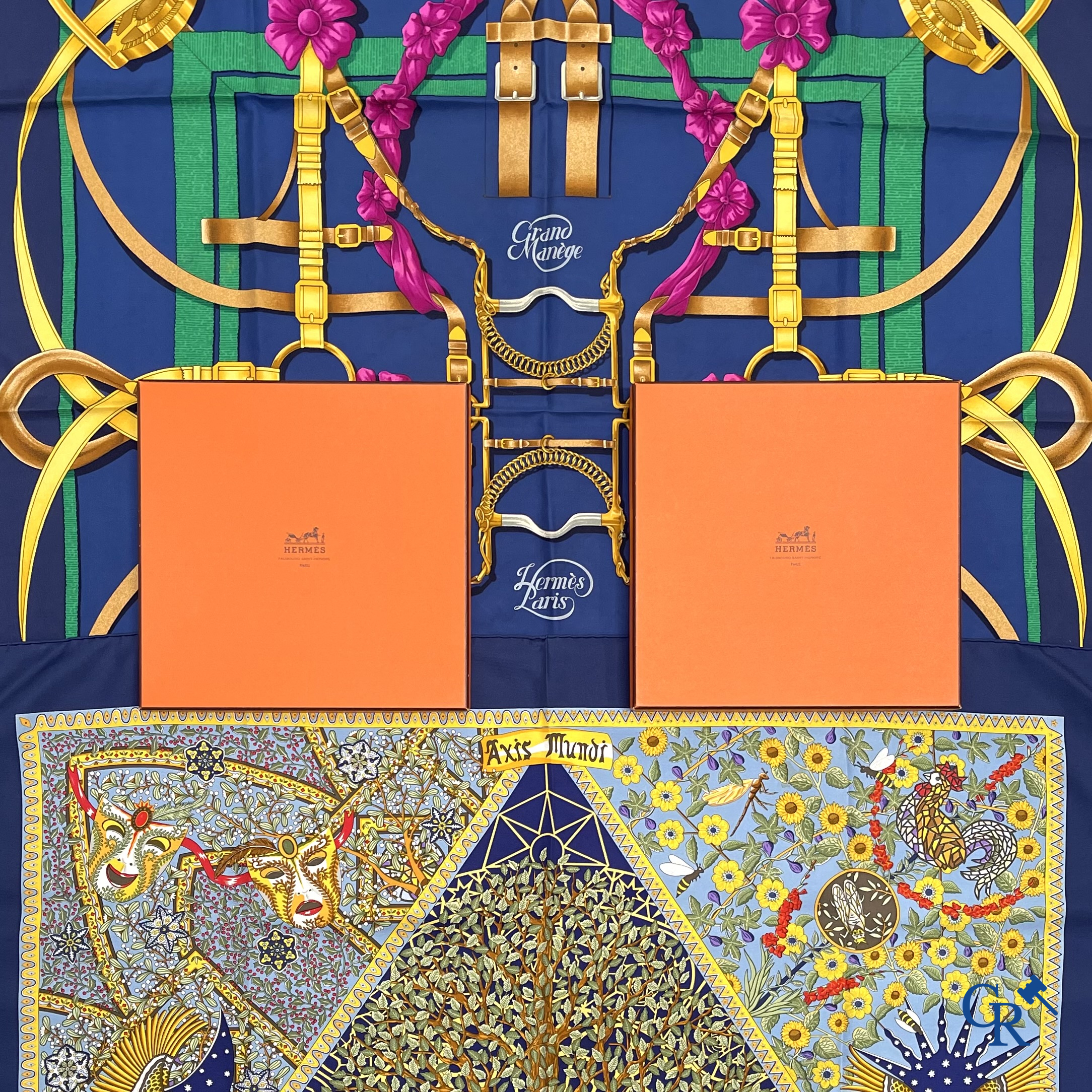 HERMES Paris. 2 Hermès sjaals in originele doos. Grand Manège, Henri d'Origny en Axis Mundi, Christine Henry.