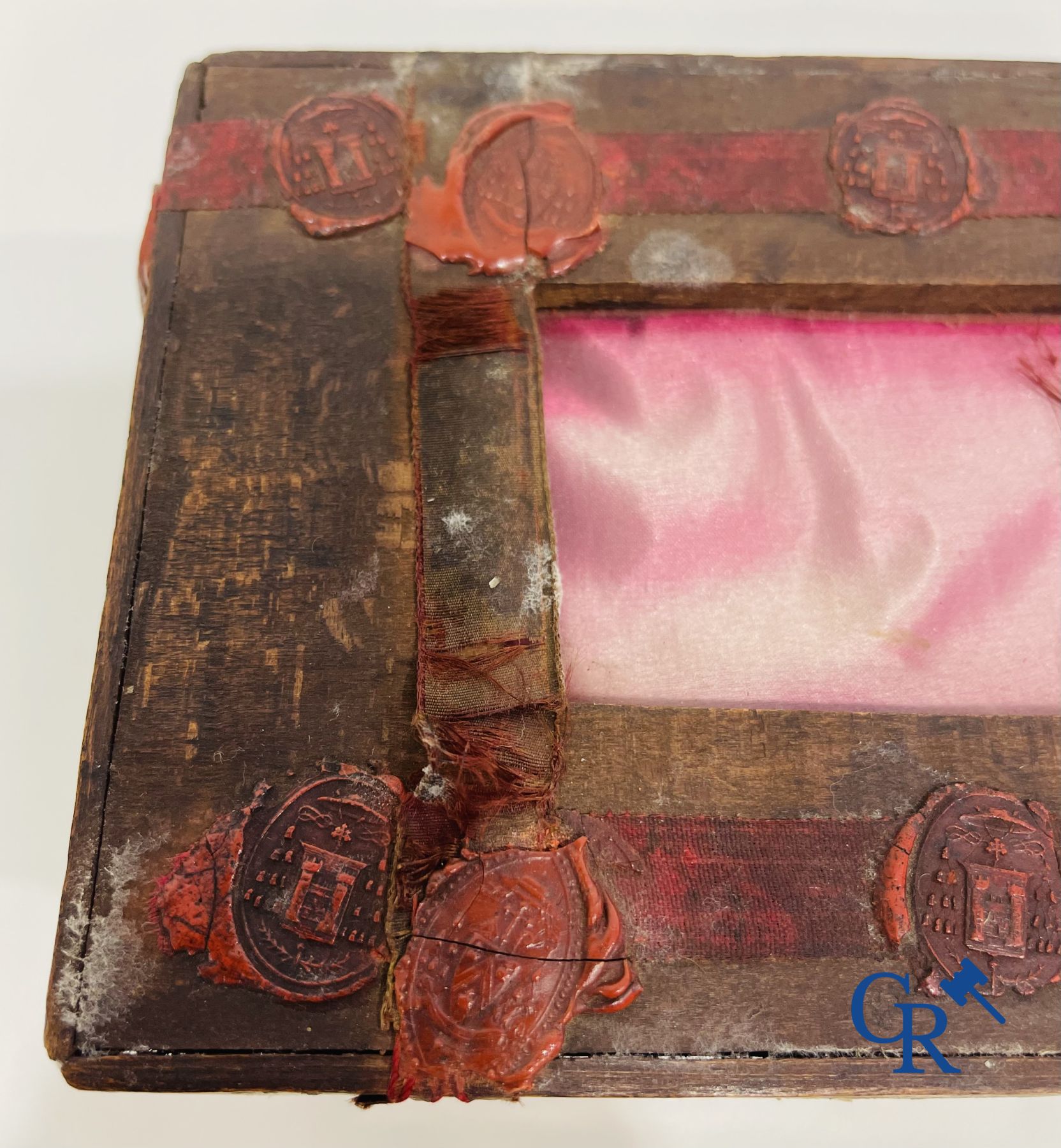 An antique wooden reliquary sealed with wax seals. Early 19th century.