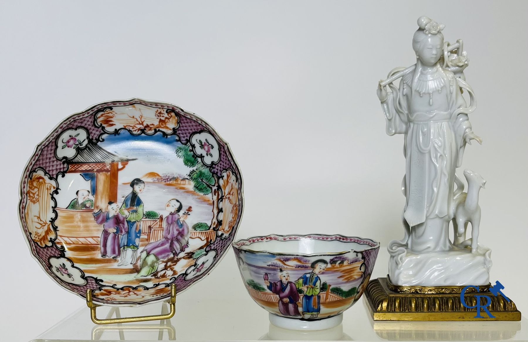 Un grand bol chinois decor mandarin en famille rose, une tasse et soucoupe en famille rose et une figurine en blanc de chine.