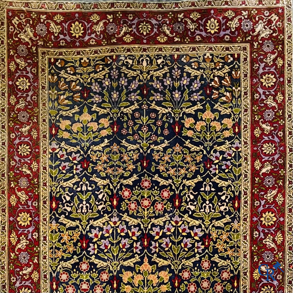 Oriental carpets, a finely hand-knotted silk carpet with floral decor.