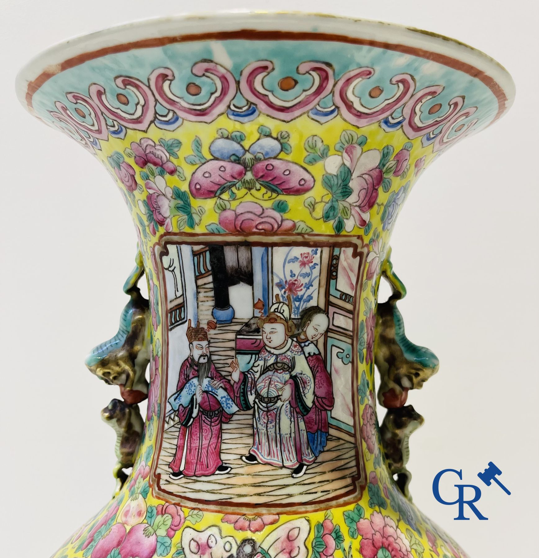 Asian art: A pair of Chinese famille rose vases with yellow background with court scenes. 19th century.