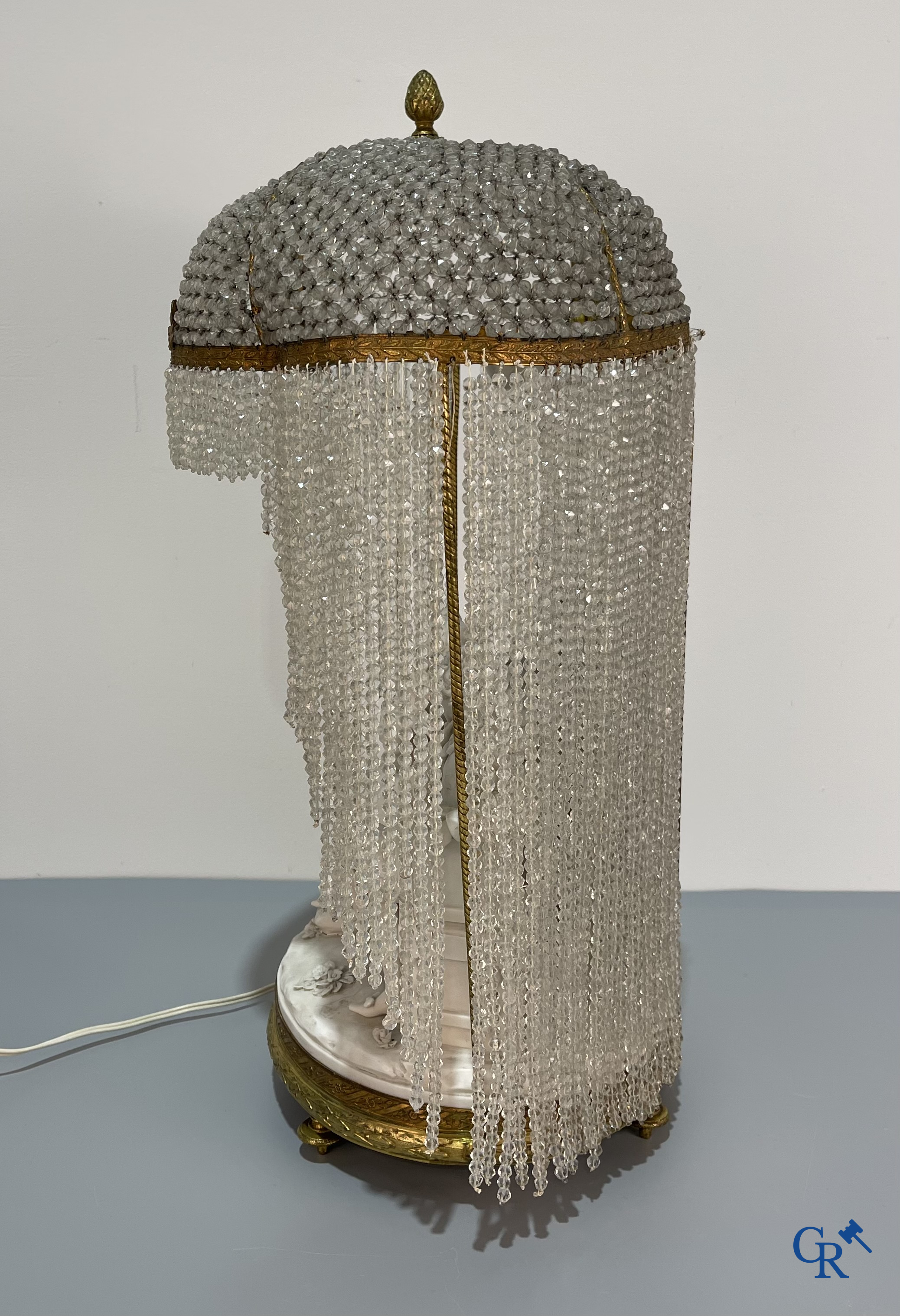 European porcelain, Karel Ens Volkstedt, a large lamp in biscuit and bronze, LXVI-style. Marked. Around 1920.