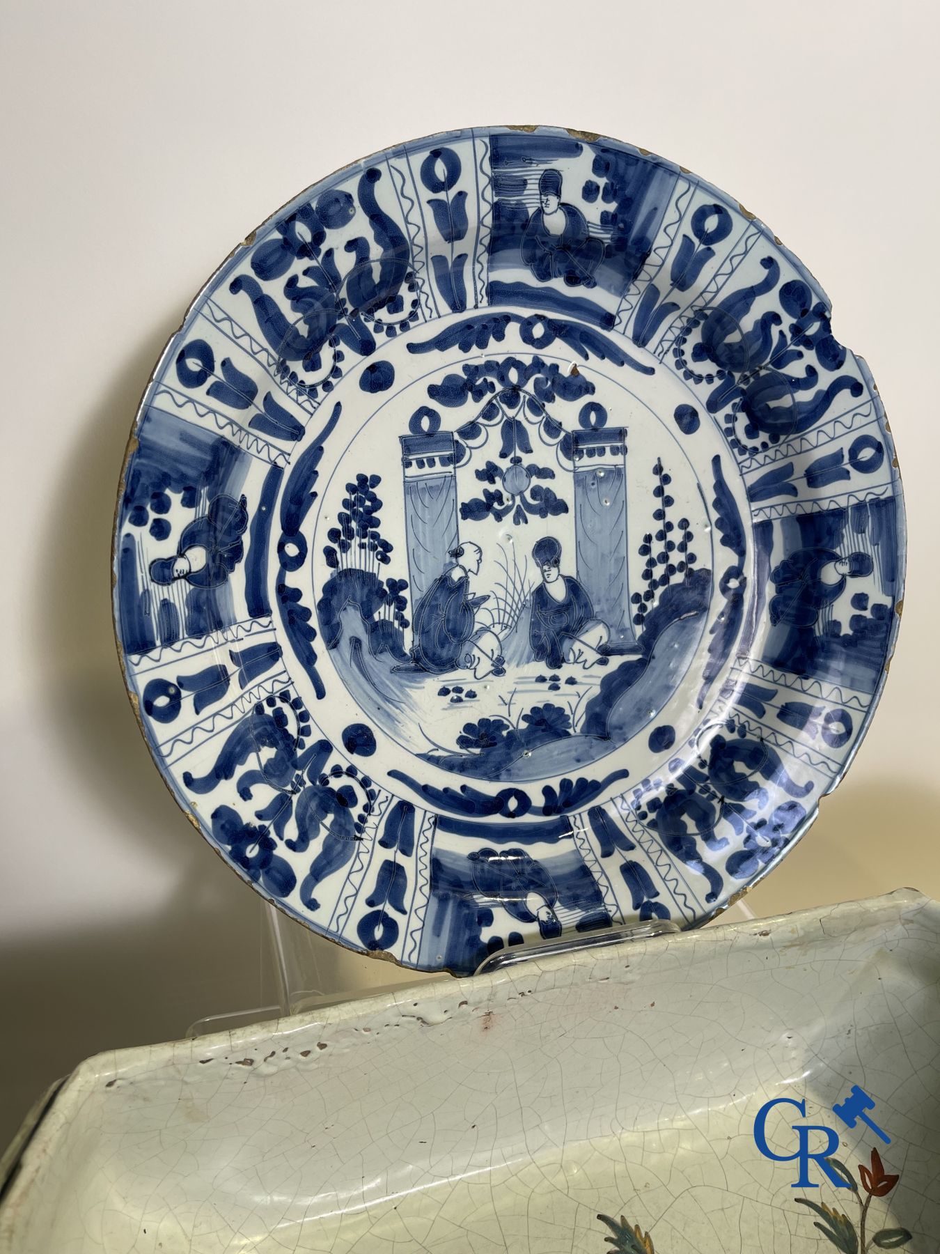 A part of a North French fountain and various pieces in faience and various antiques.