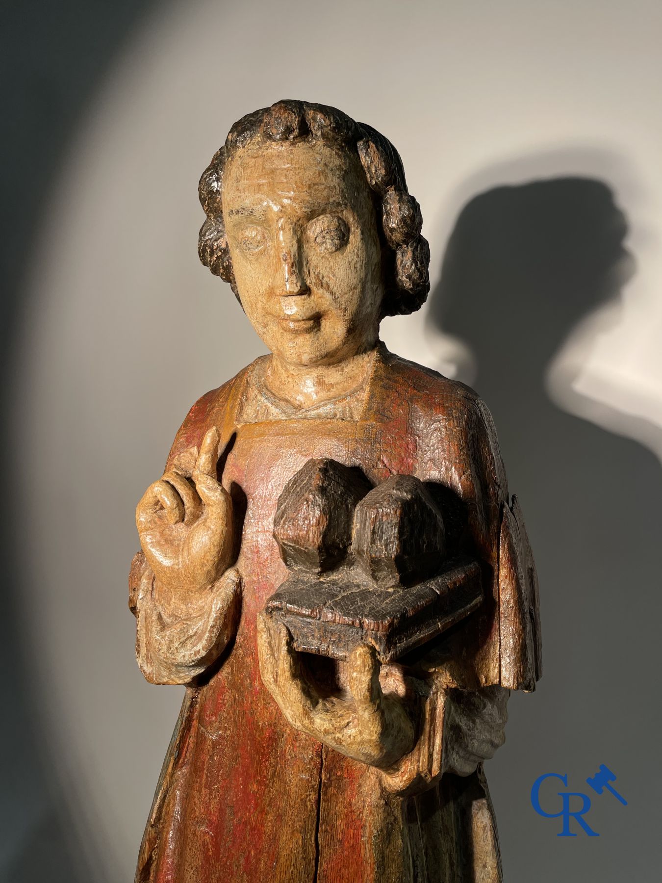 Wooden sculpture: Polychrome wood sculpture of a saint. Saint Stephen. Probably 17th century.