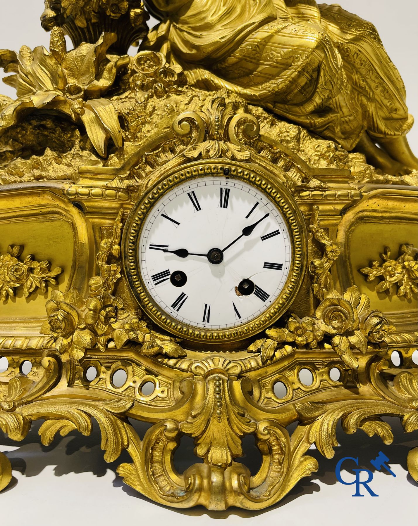 Bronze gilded clock with a romantic performance. 19th century.