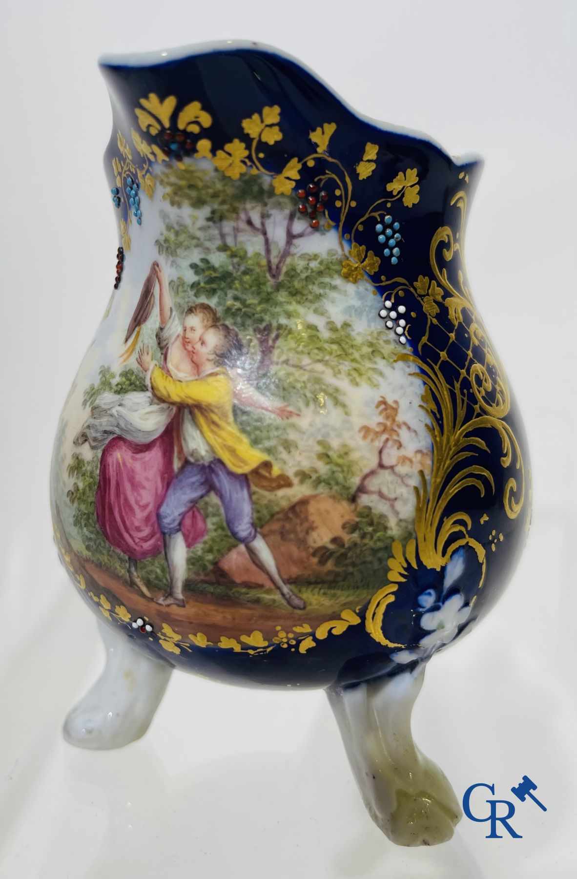 Vincennes 18th century. A three-legged milk jug in soft porcelain with lapis blue background.