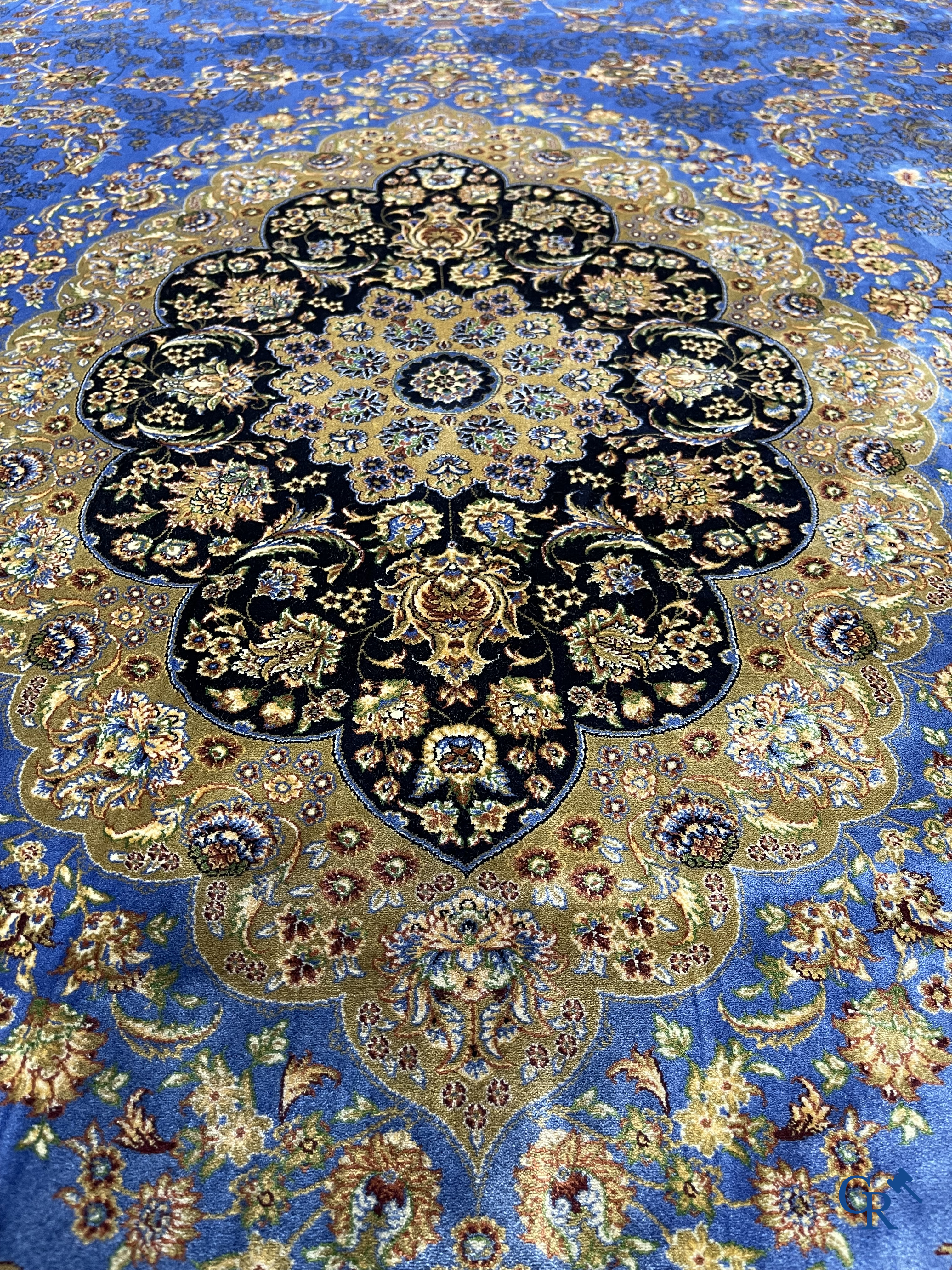 Carpets. Exceptional silk carpet with floral decor on a blue background.