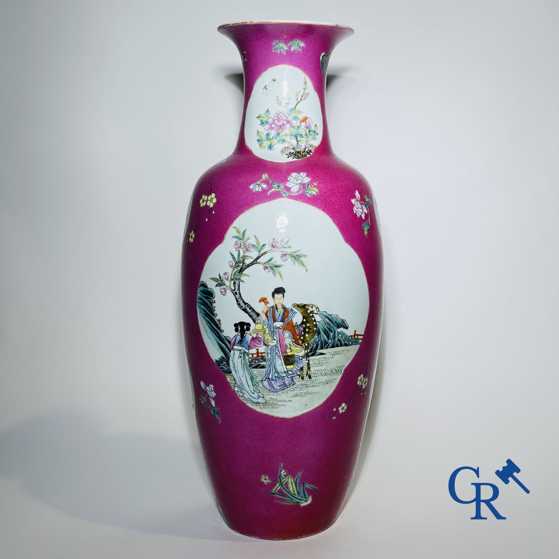 Chinese porcelain: A fine famille rose vase decorated on a red ruby background in sgraffito technique.