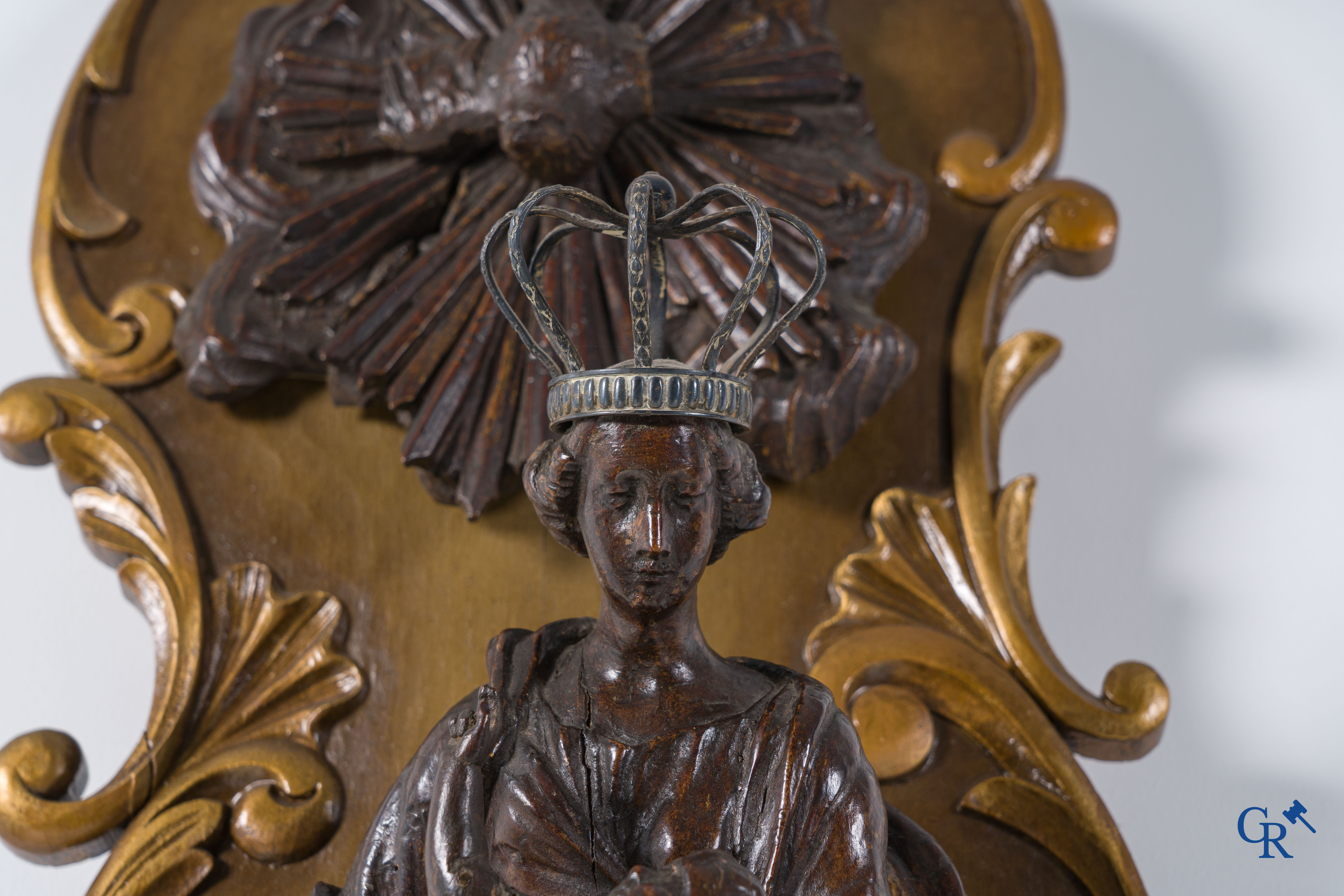 Imposing wooden sculpture of Mary with child, richly sculpted with angels and a dragon. 17th-18th century.