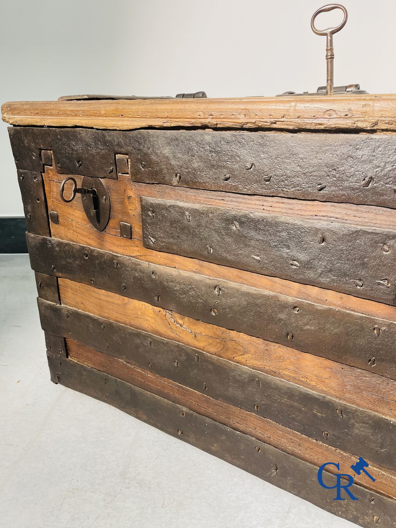 Antique wooden chest with hardware and lockwork in forging.