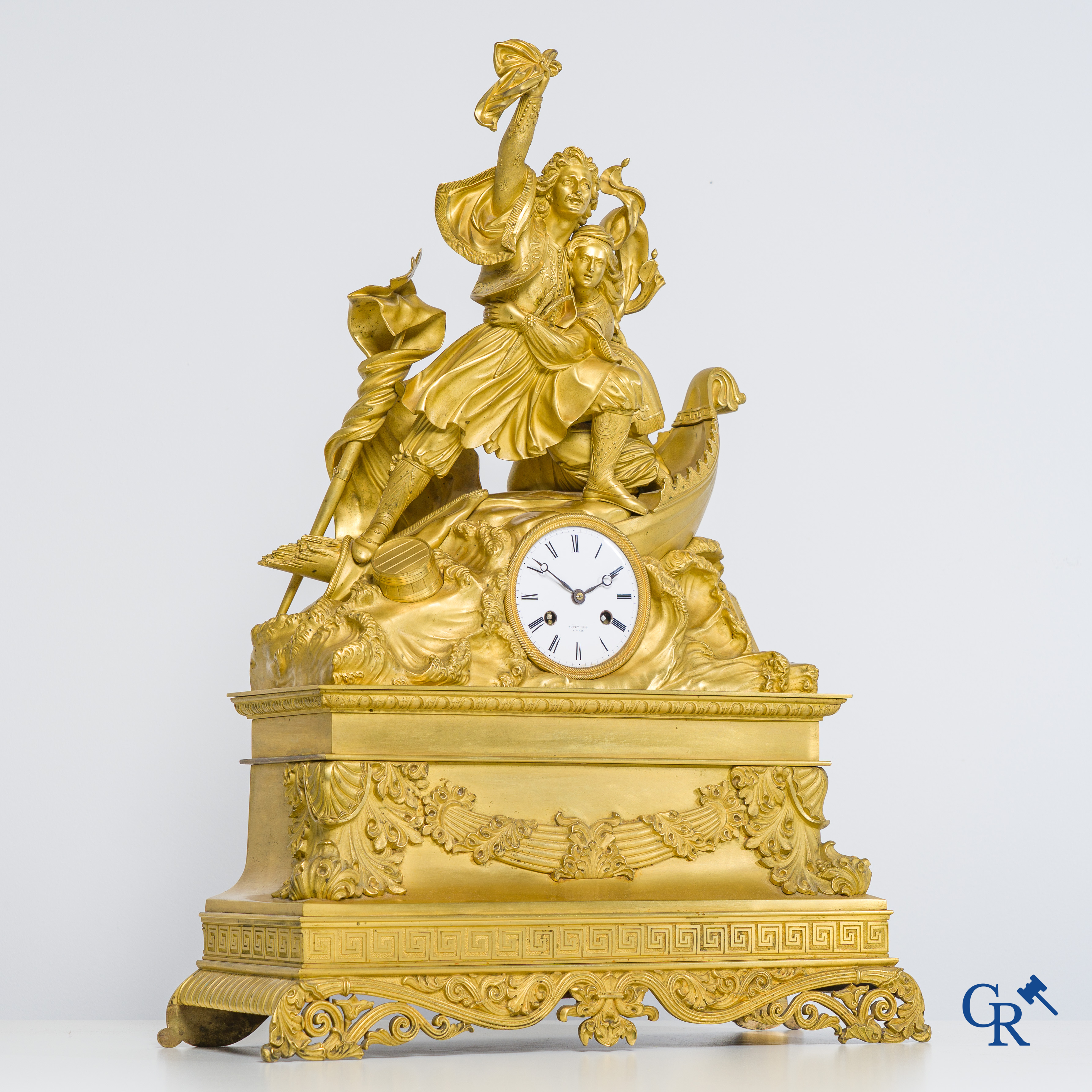 Butet horlogier à Paris. Gilded bronze chimney clock with enamelled dial. Charles X period.