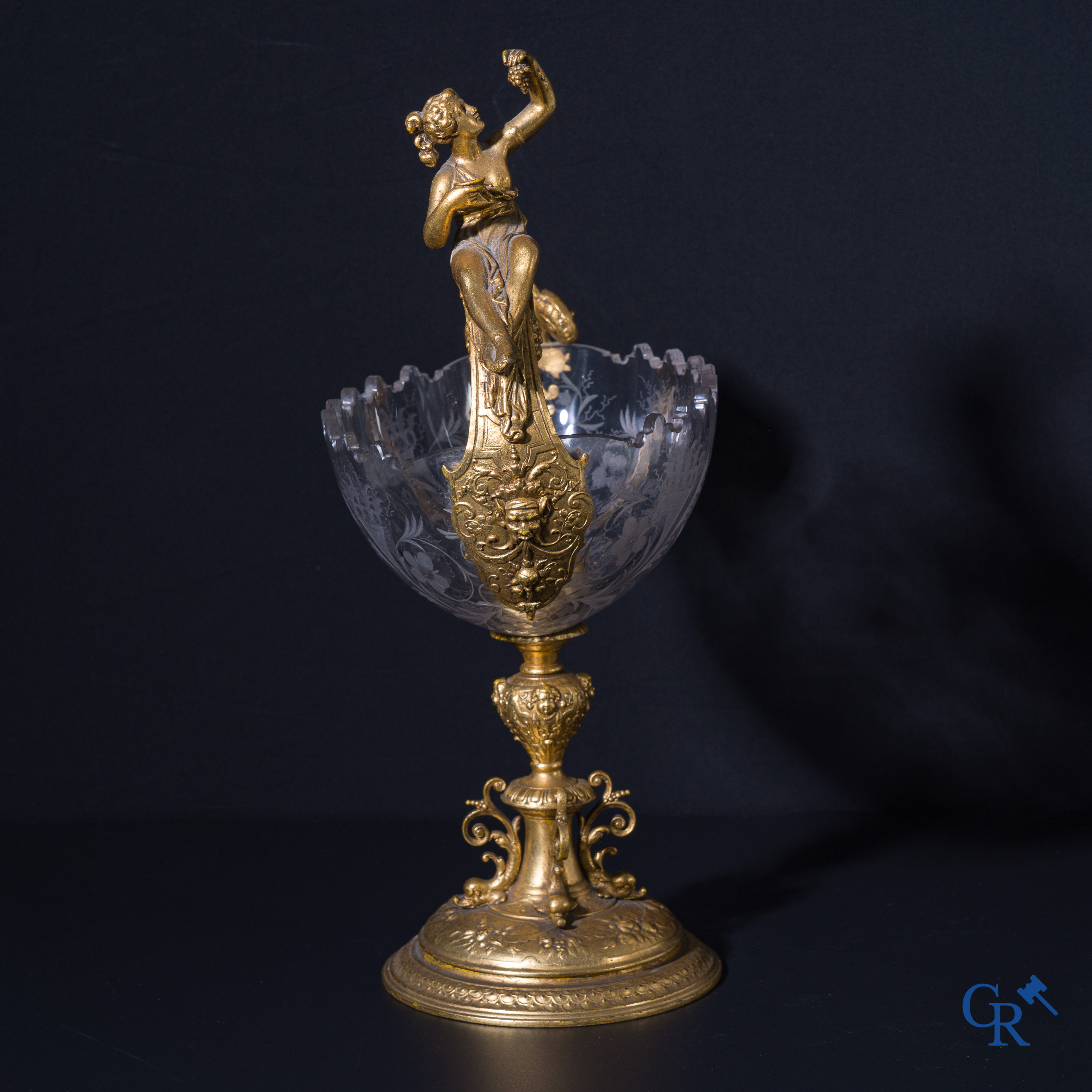 A gilded Renaissance-style table centerpiece with a richly cut crystal coupe. Late 19th century.