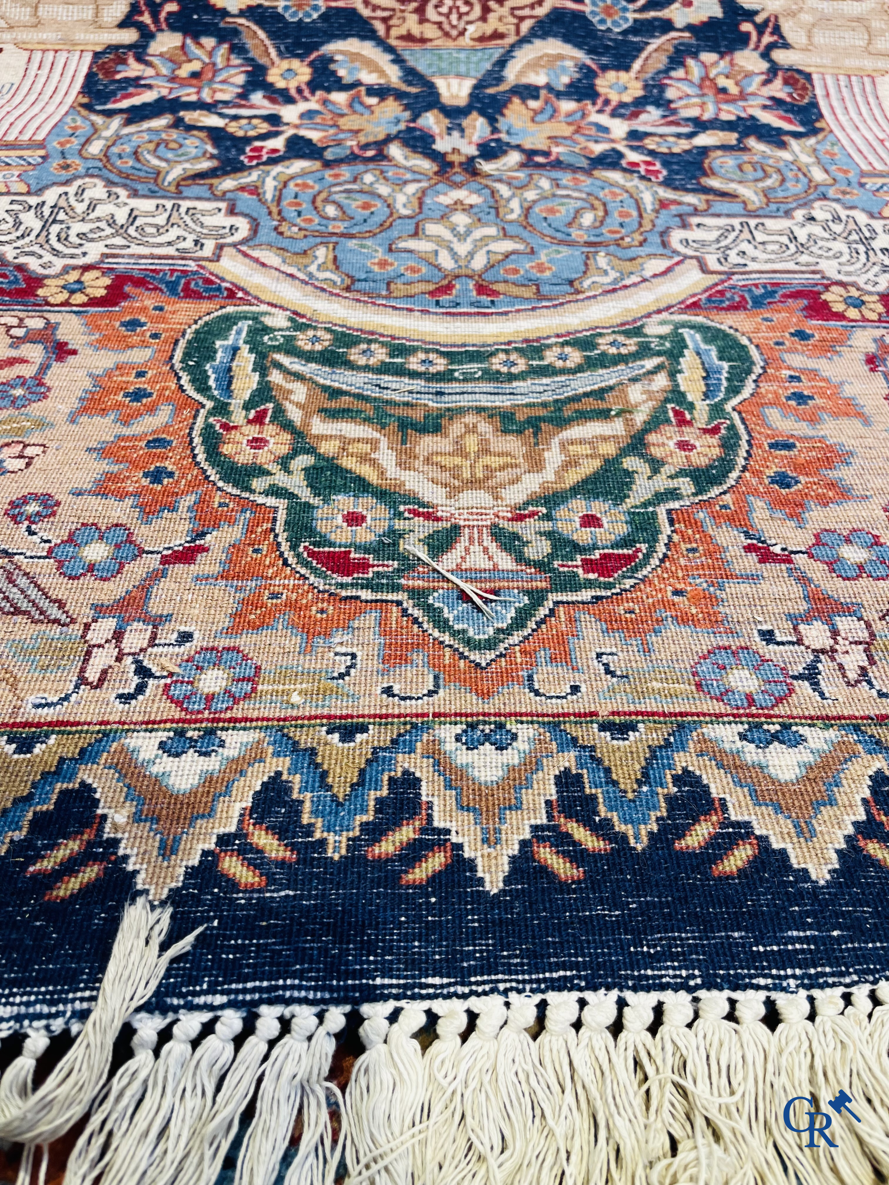 Oriental carpets: A large hand-knotted oriental carpet with antique decor. Multiple inscriptions.