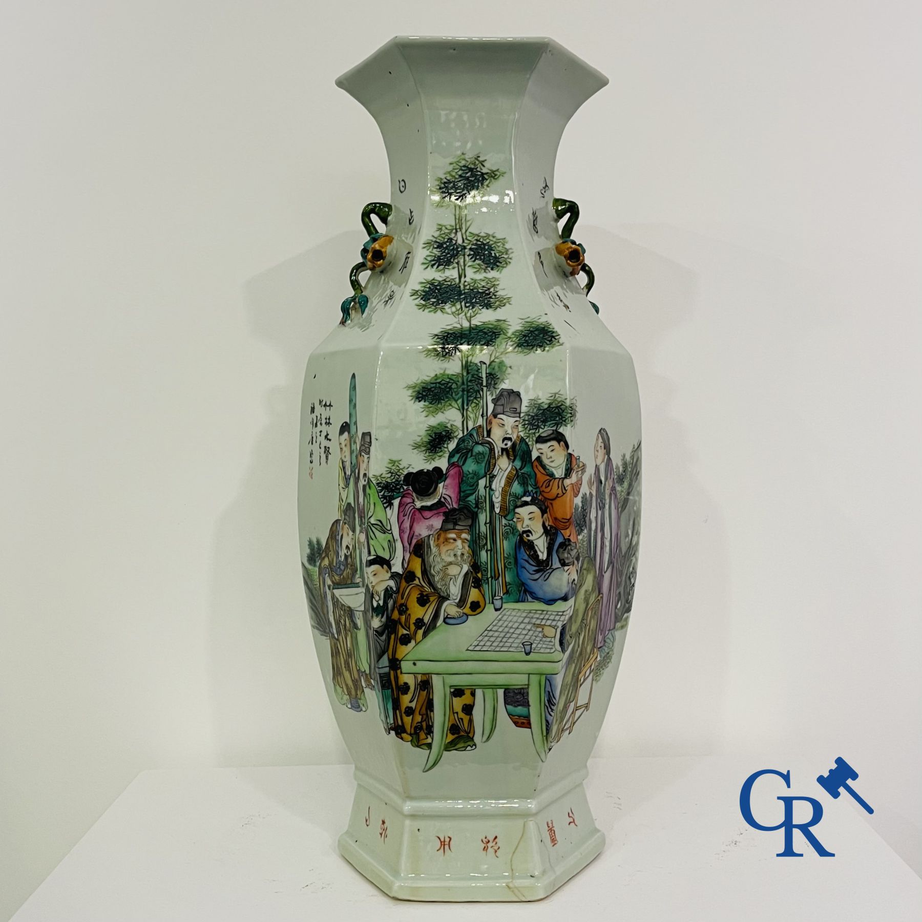 Asian Art: Chinese porcelain. A hexagonal Chinese Famille rose vase with sages and scholars. 19/20th century.