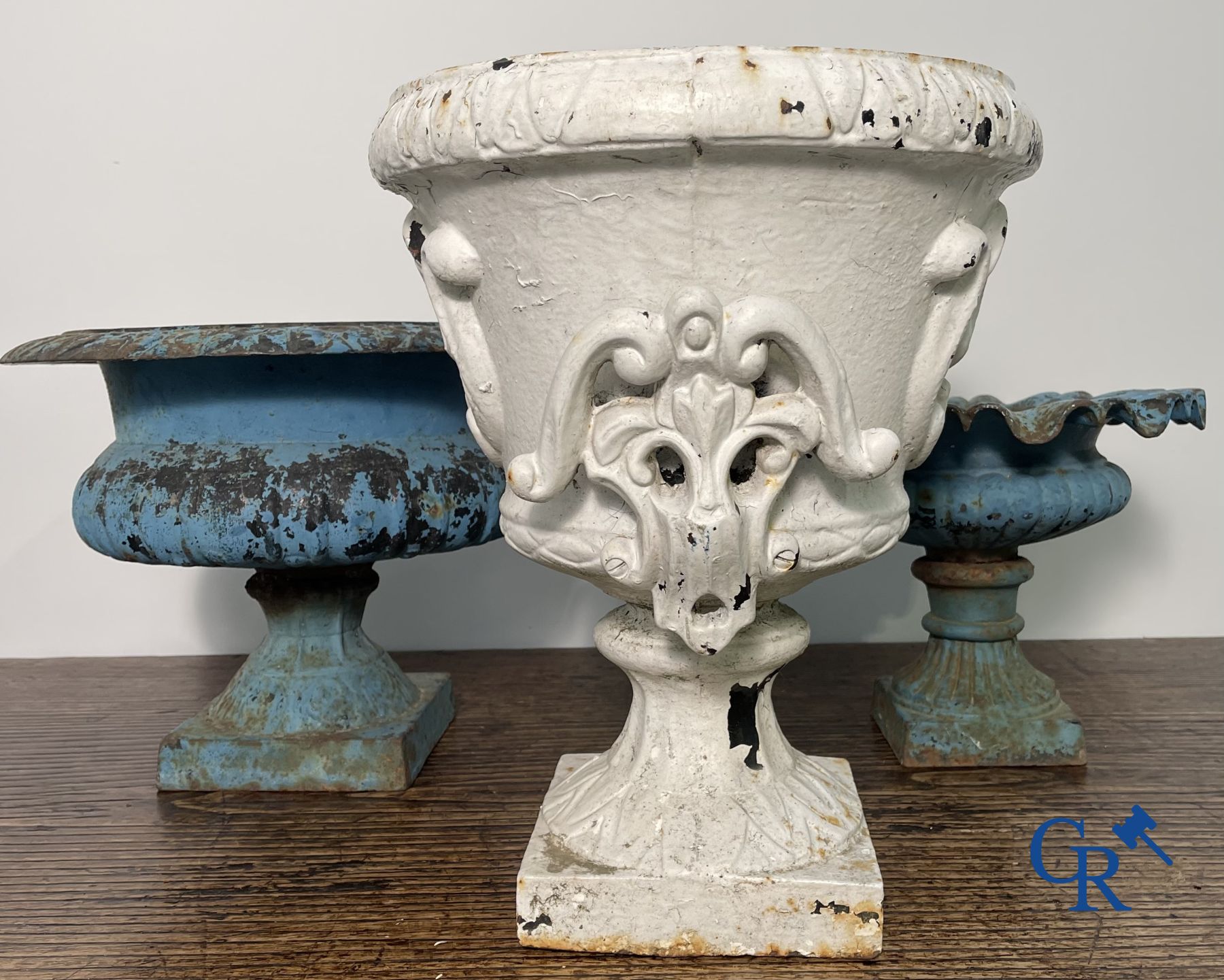 4 cast iron garden vases.