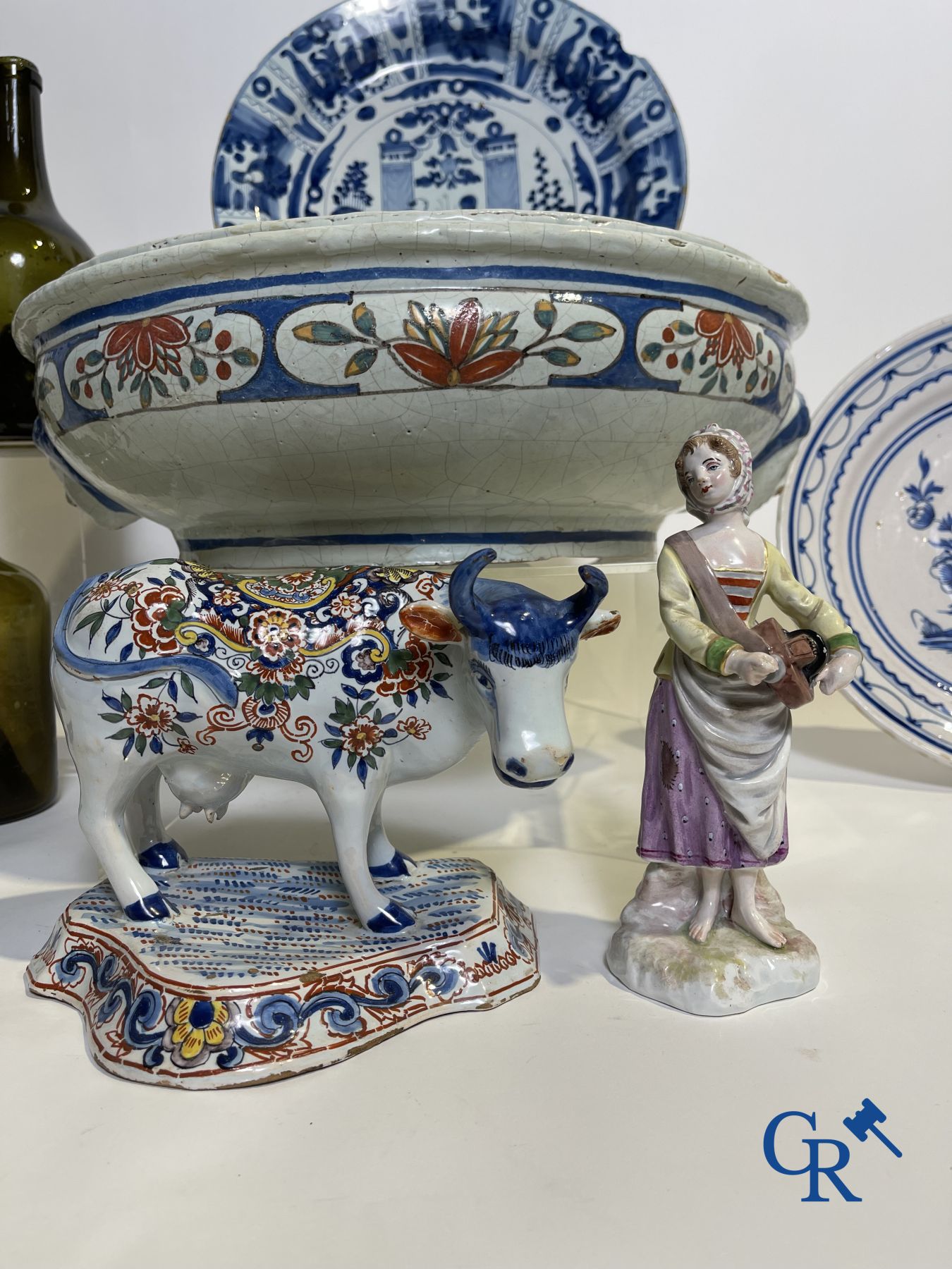 A part of a North French fountain and various pieces in faience and various antiques.