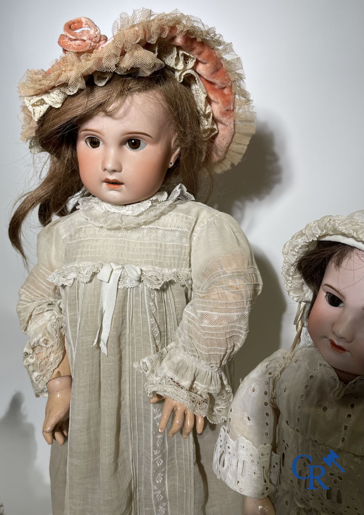 Toys: antique dolls: 2 dolls with porcelain head and a dog.