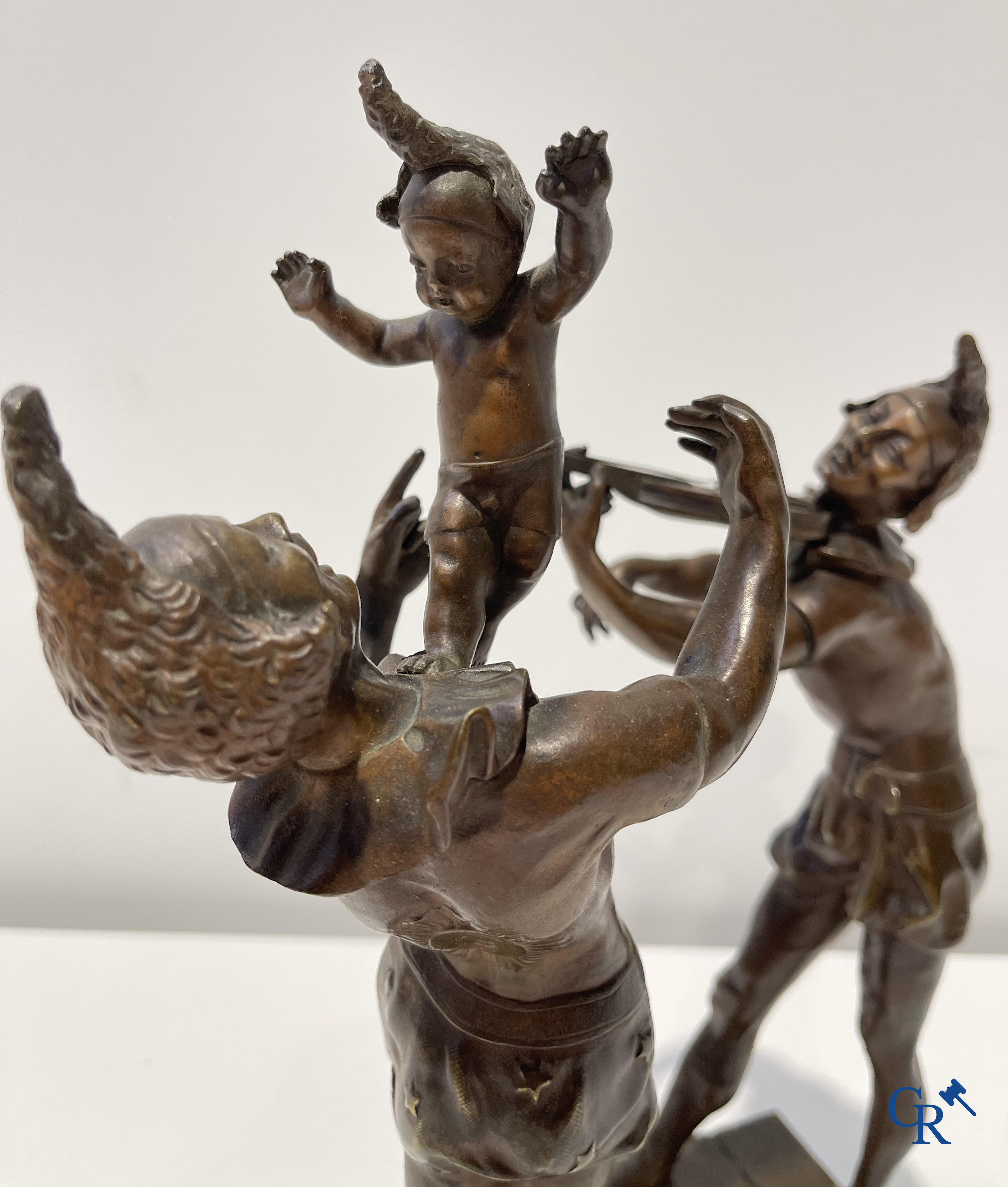 Auguste de Wever (1836-1910) Pair of bronze statues, harlequin with child and music playing harlequin.