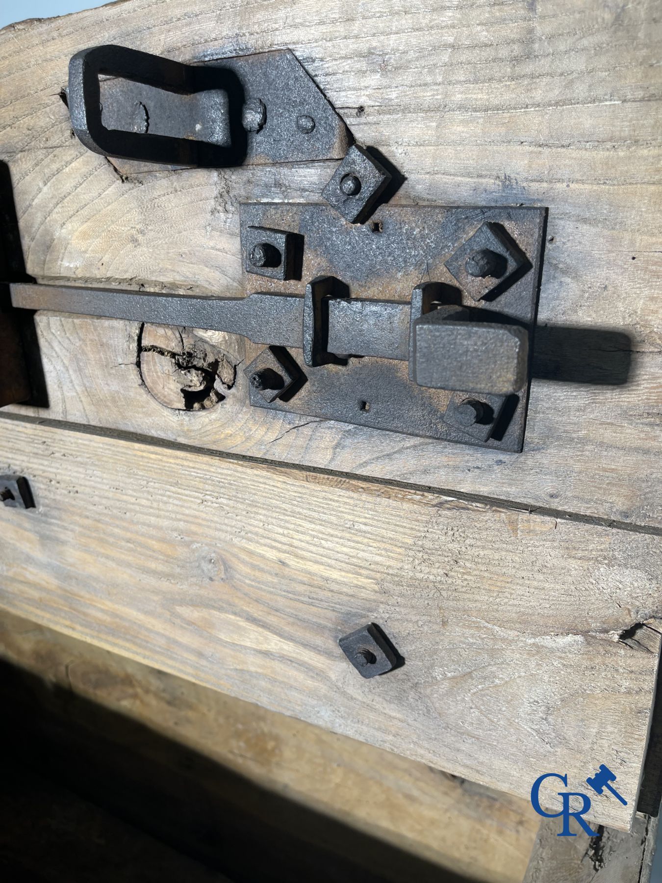 Antique wooden chest with hardware and lockwork in forging.