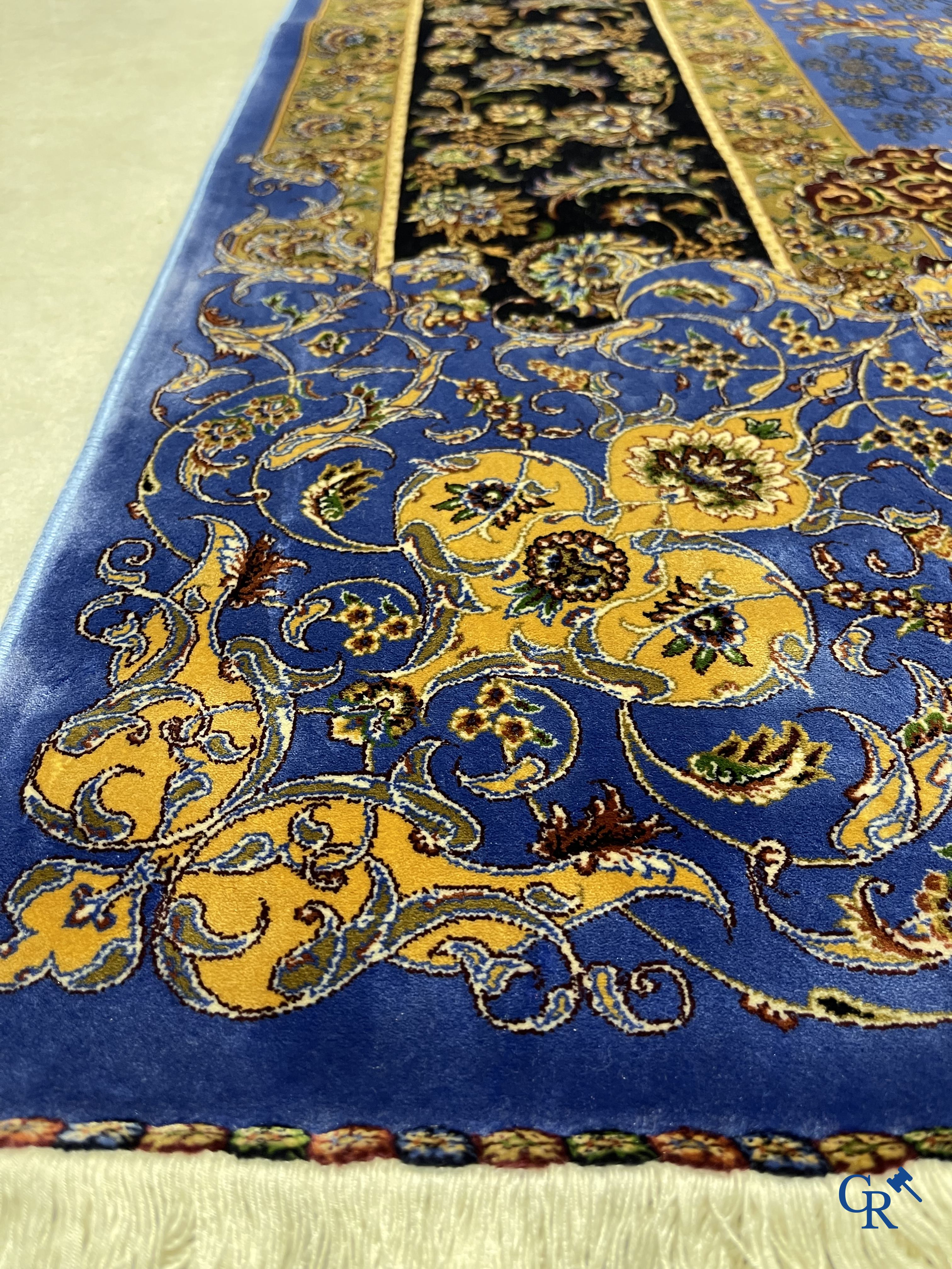 Carpets. Exceptional silk carpet with floral decor on a blue background.