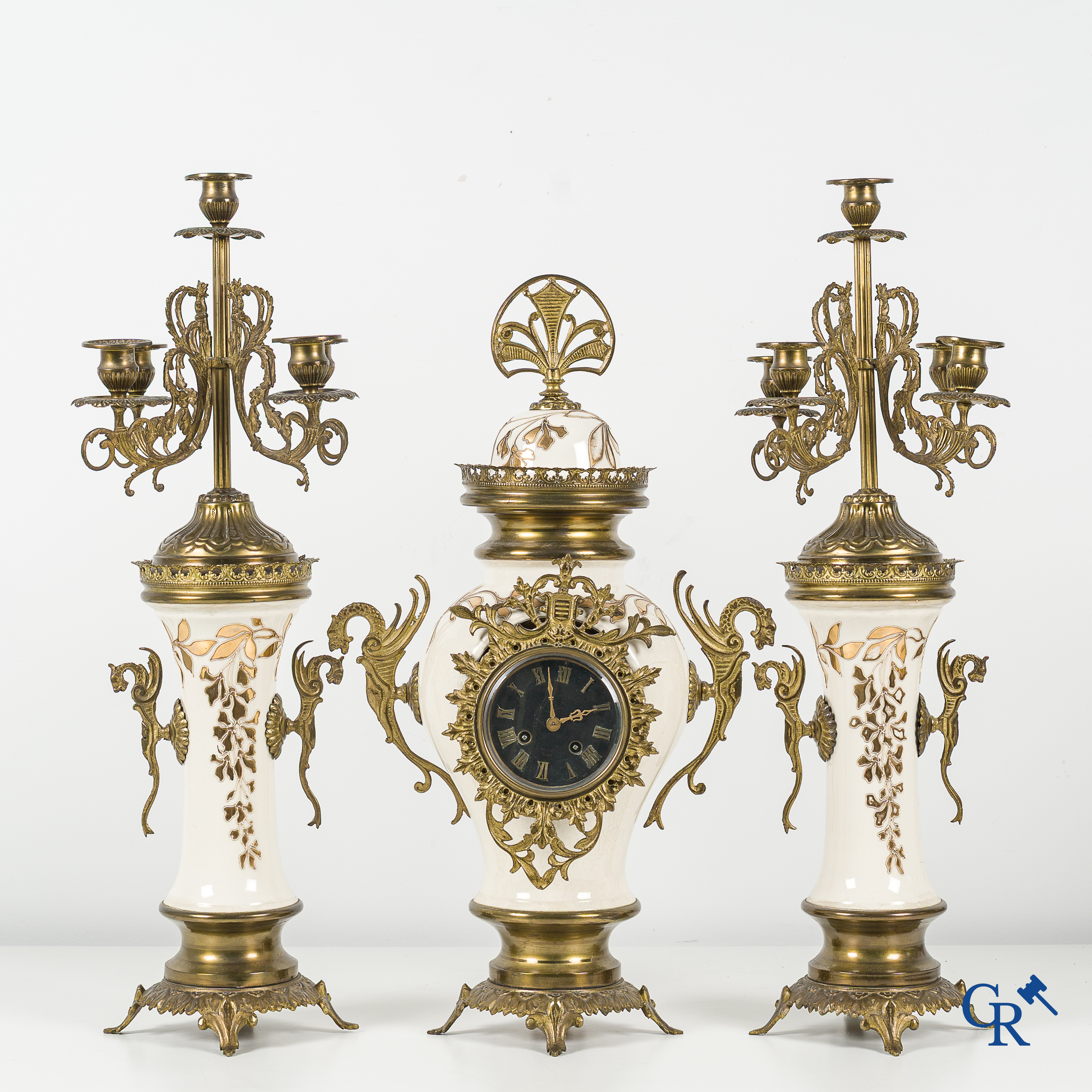 Art Nouveau. Lot consisting of a clock set in faience and bronze and a pair enamelled opaline vases.