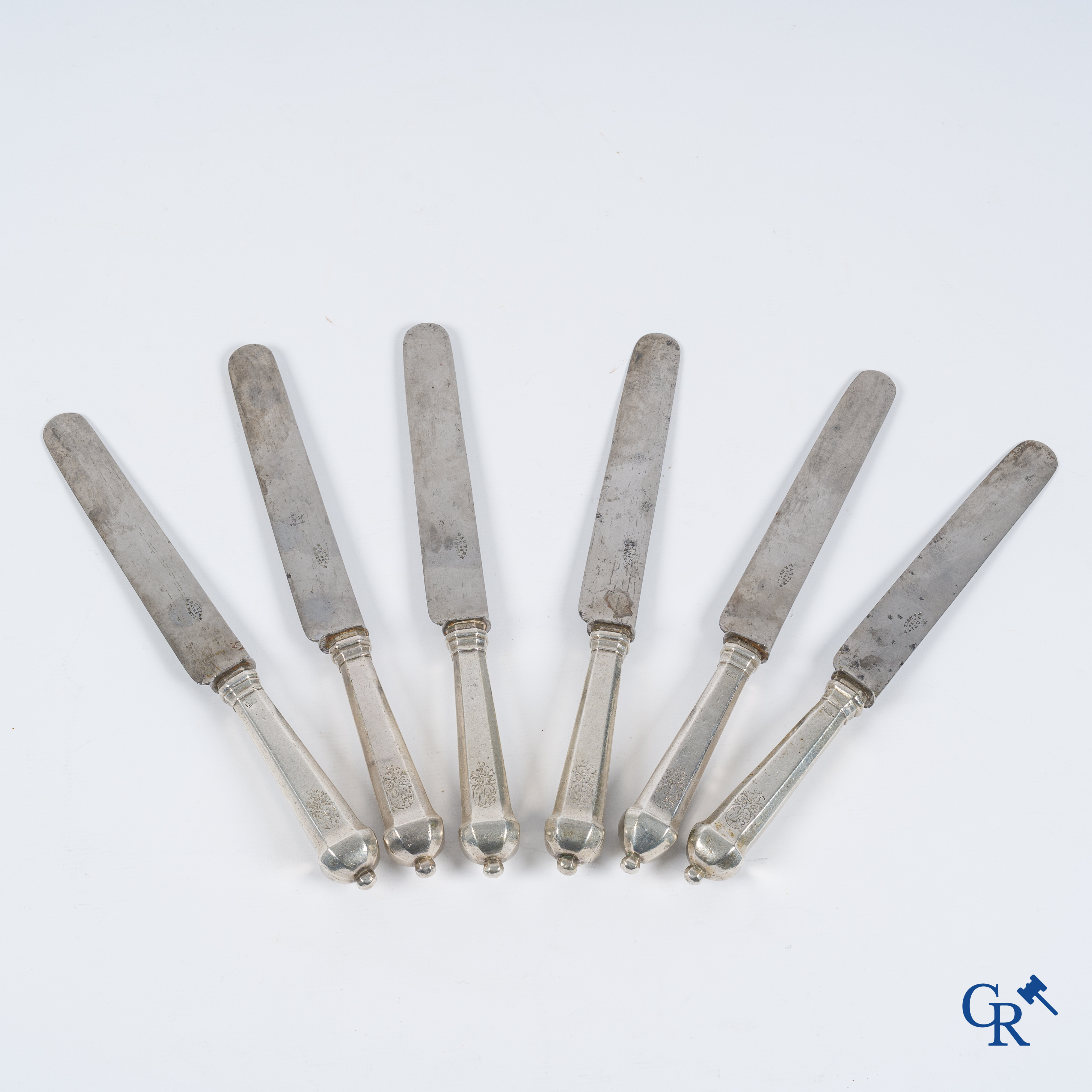 Silver. Set of 6 knives with silver handles decorated with coats of arms. Most probably Liège, 18th century.