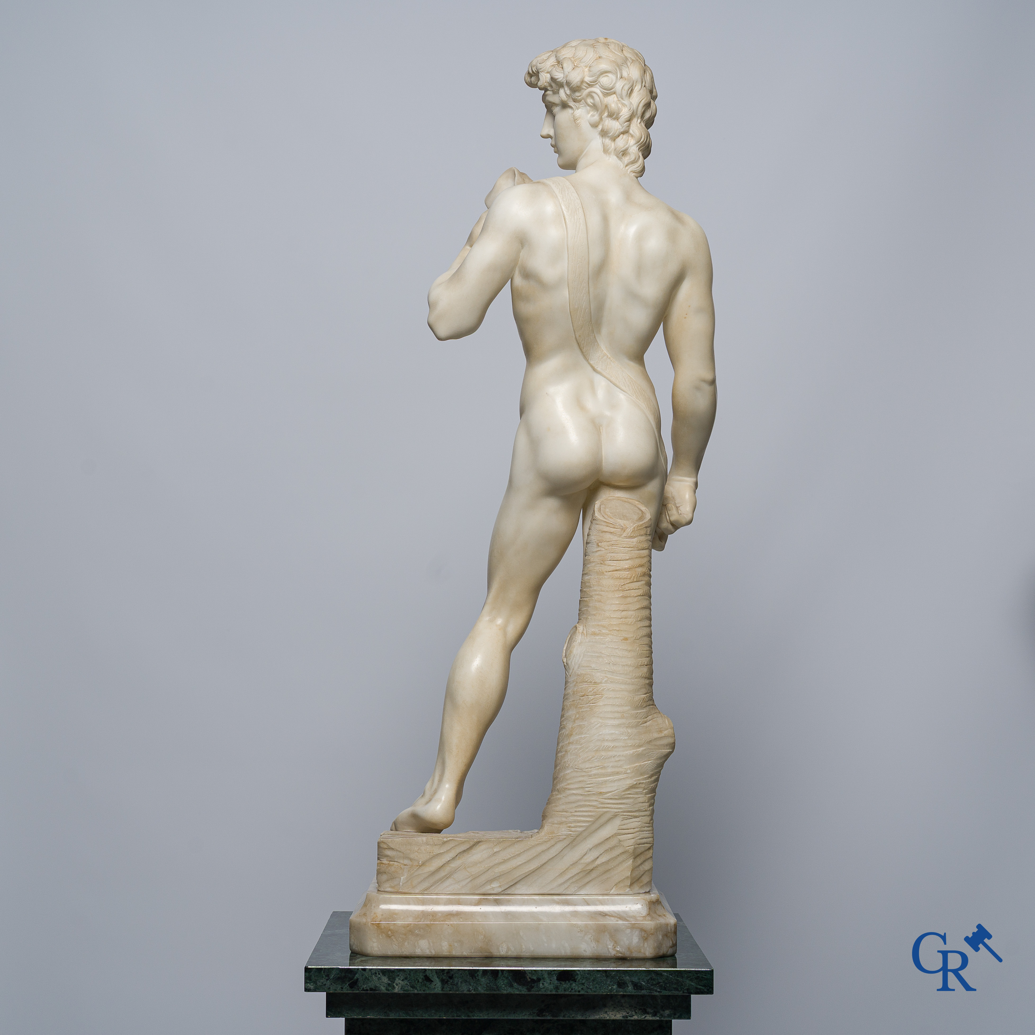 Michelangelo (after) In the antique style. Representation of David in sculpted marble. Mid-20th century.