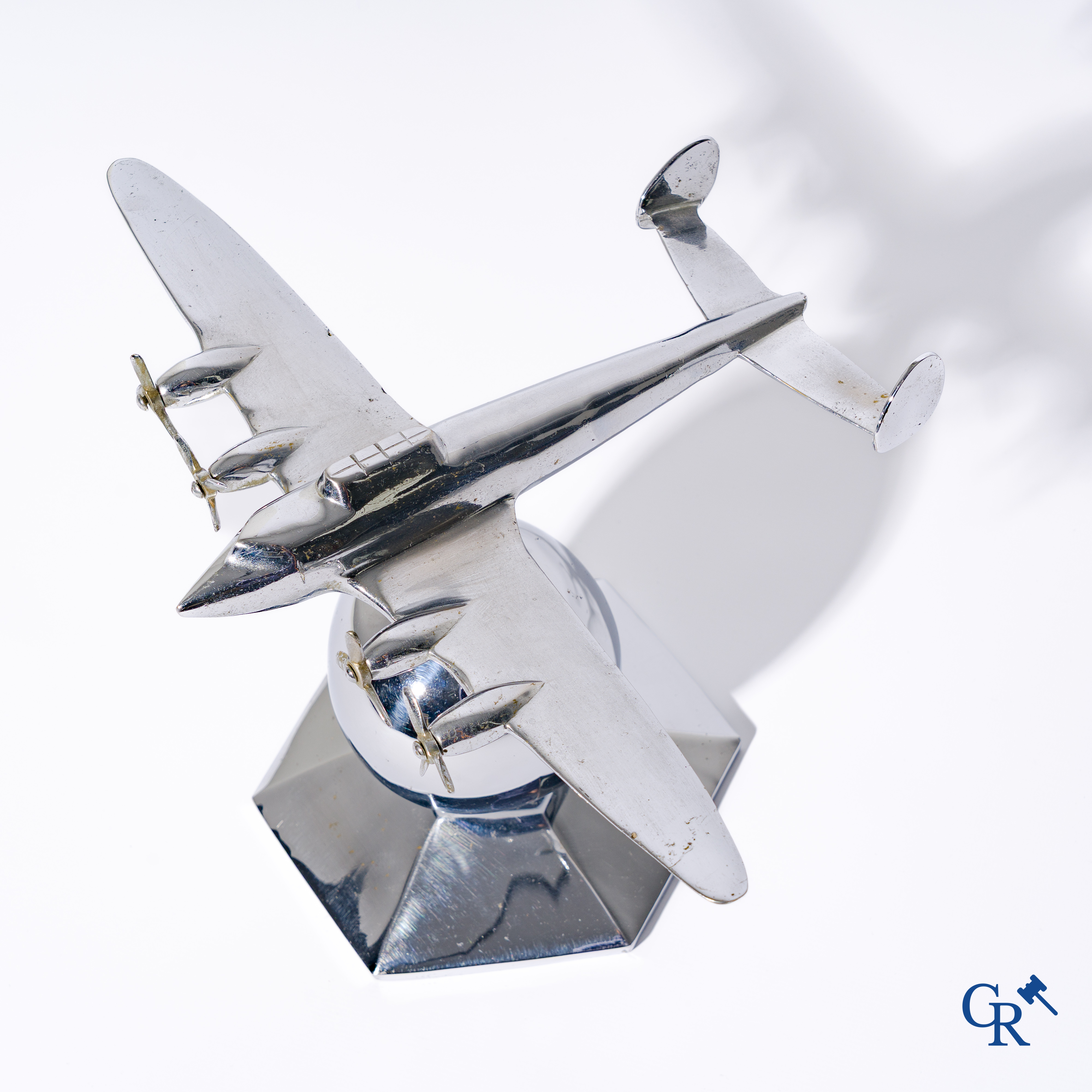 Art Deco, a 1930's desk model of an aircraft in chrome-plated bronze mounted on a stand.