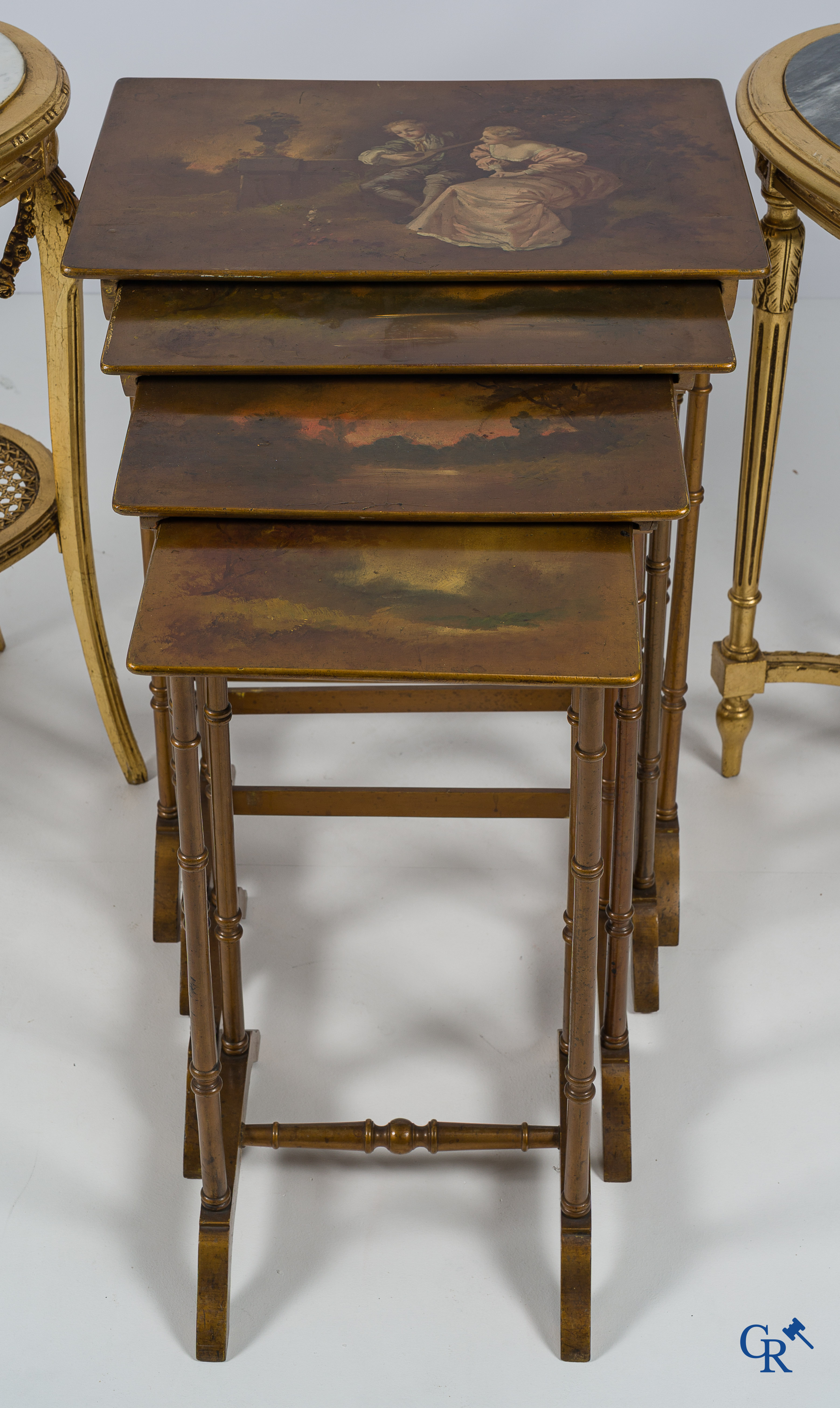 Furniture. 2 gilded geuridons in LXVI style and a set of nesting tables with Varnish Martin painting. Circa 1920.