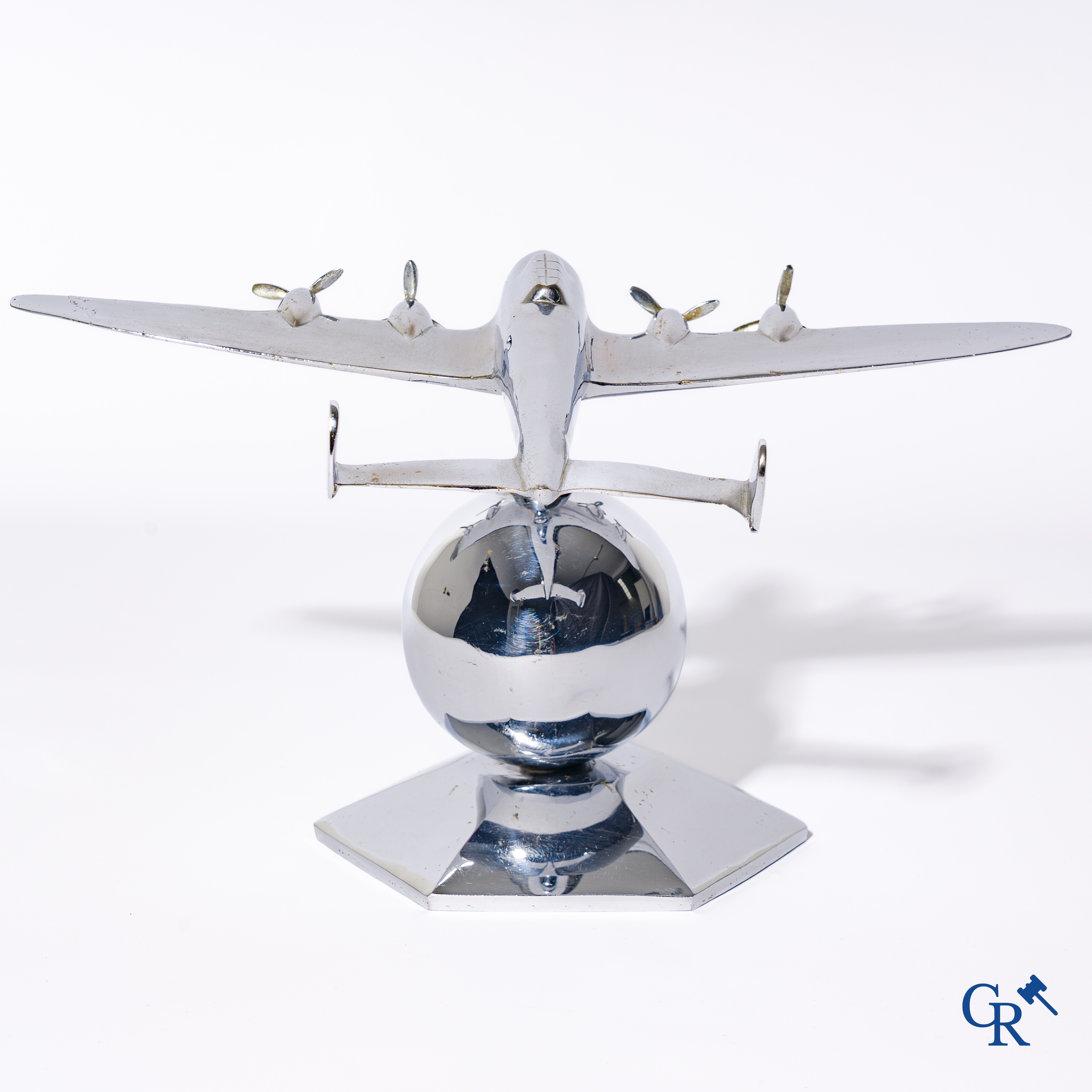Art Deco, a 1930's desk model of an aircraft in chrome-plated bronze mounted on a stand.