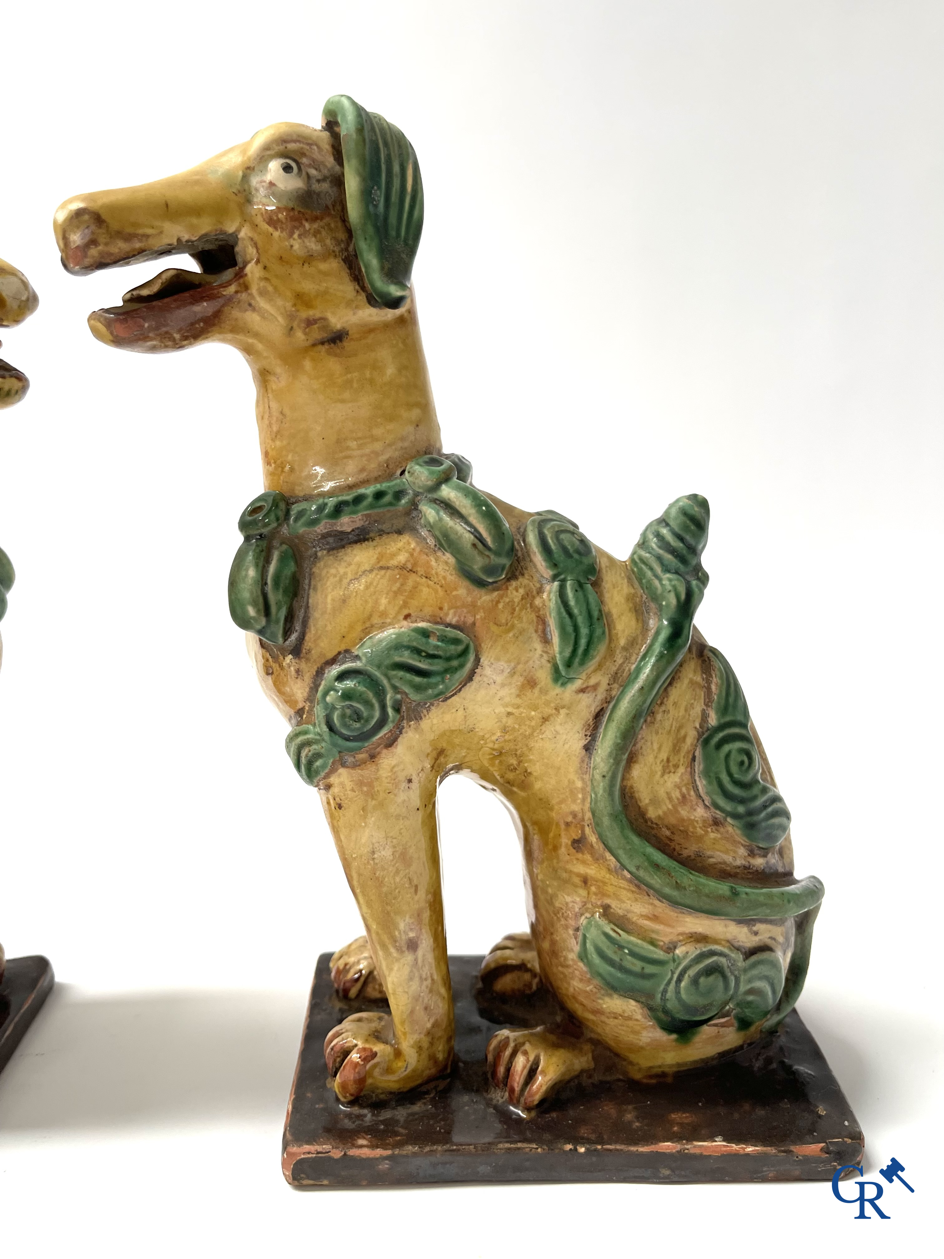 Asian Art, Chine. A pair of seated enamelled terra cotta dogs. 18th-19th century.