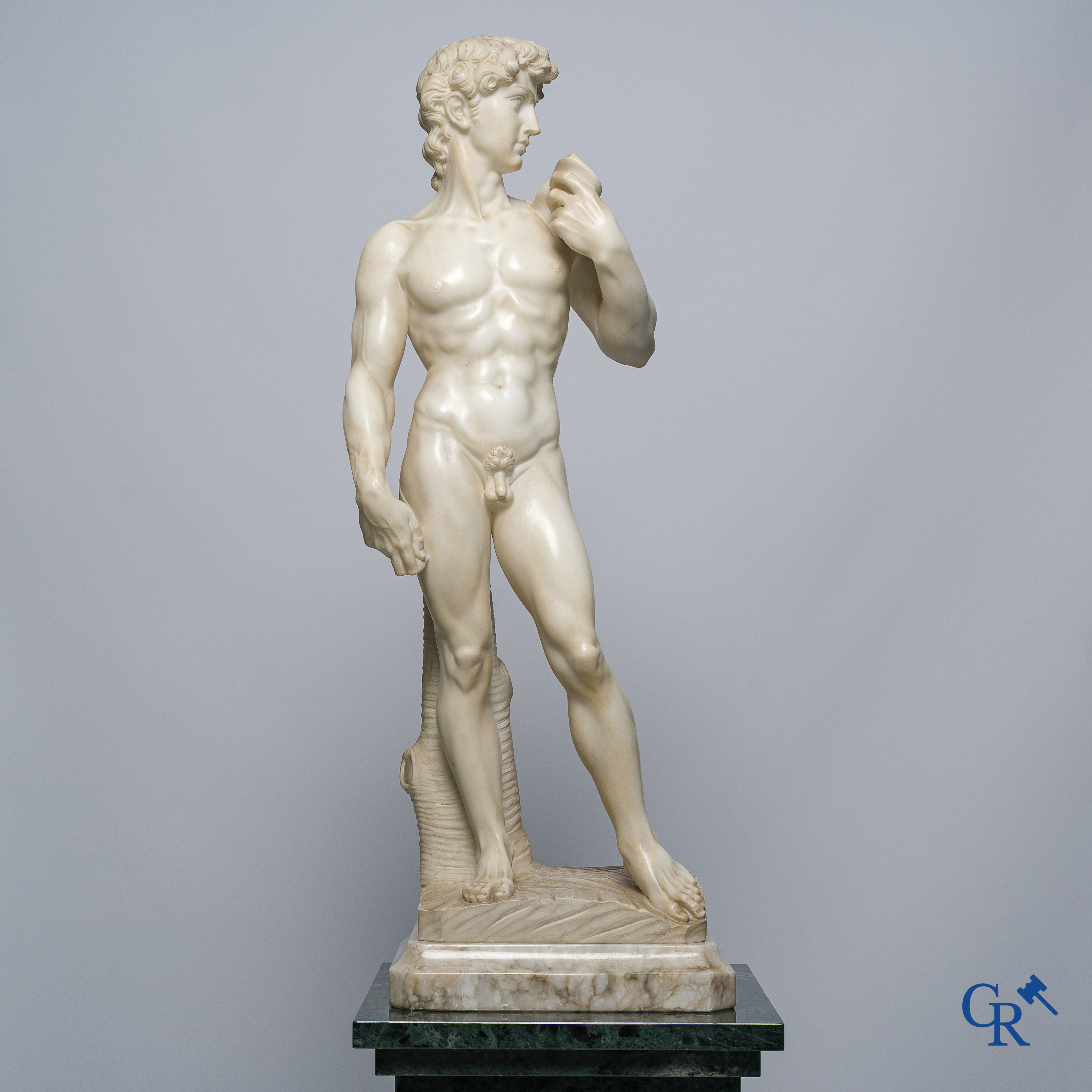 Michelangelo (after) In the antique style. Representation of David in sculpted marble. Mid-20th century.