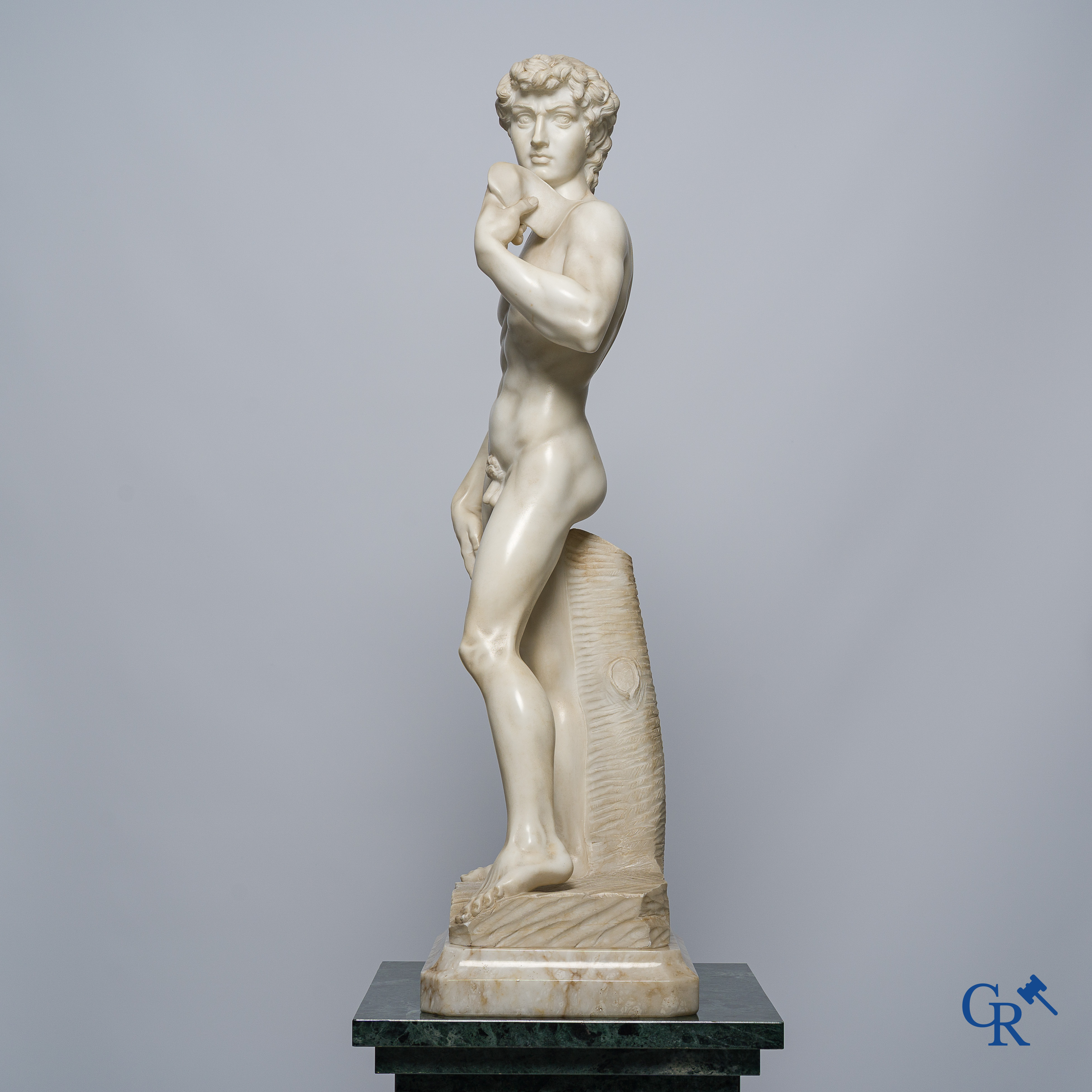 Michelangelo (after) In the antique style. Representation of David in sculpted marble. Mid-20th century.