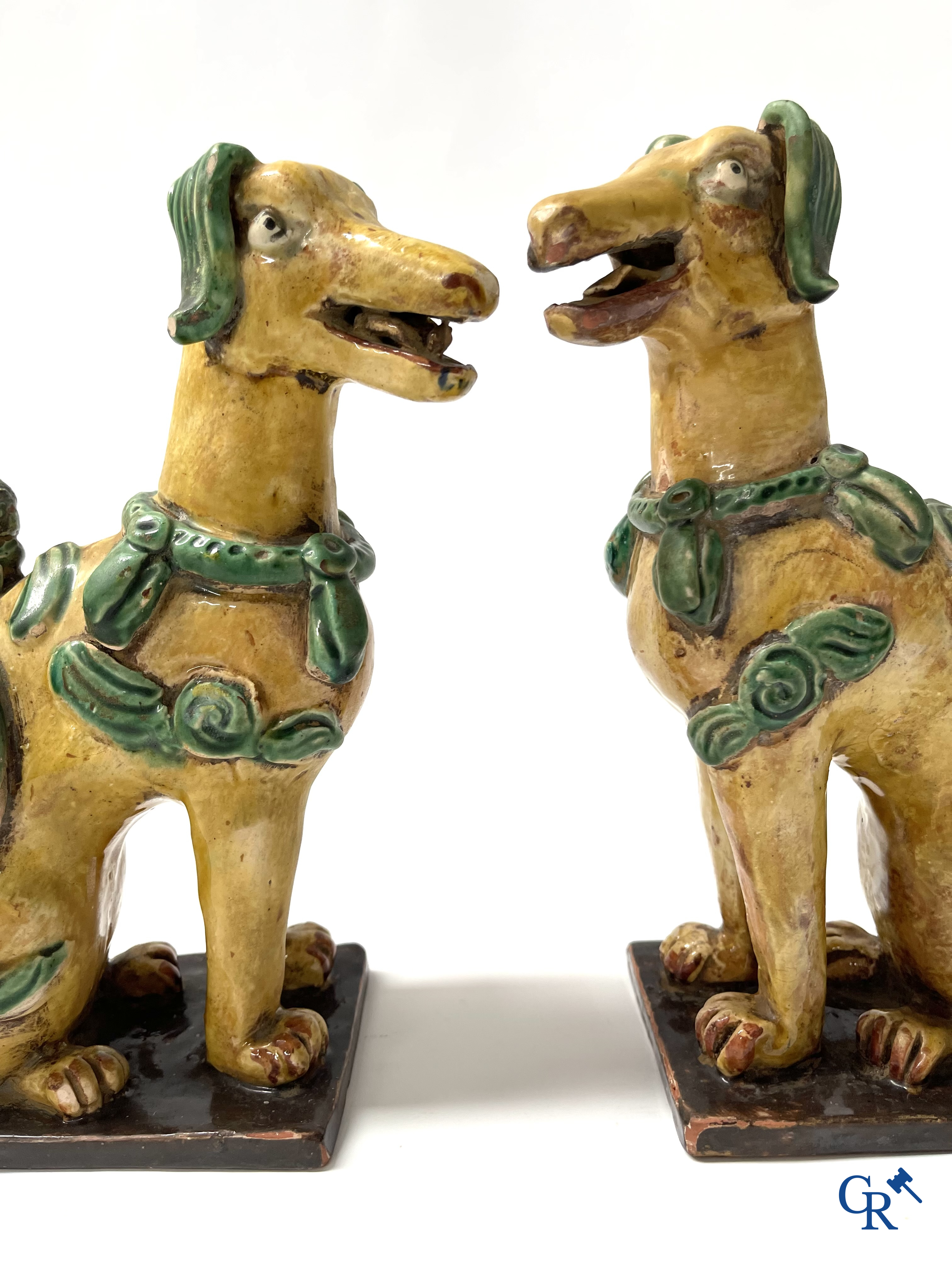 Asian Art, Chine. A pair of seated enamelled terra cotta dogs. 18th-19th century.