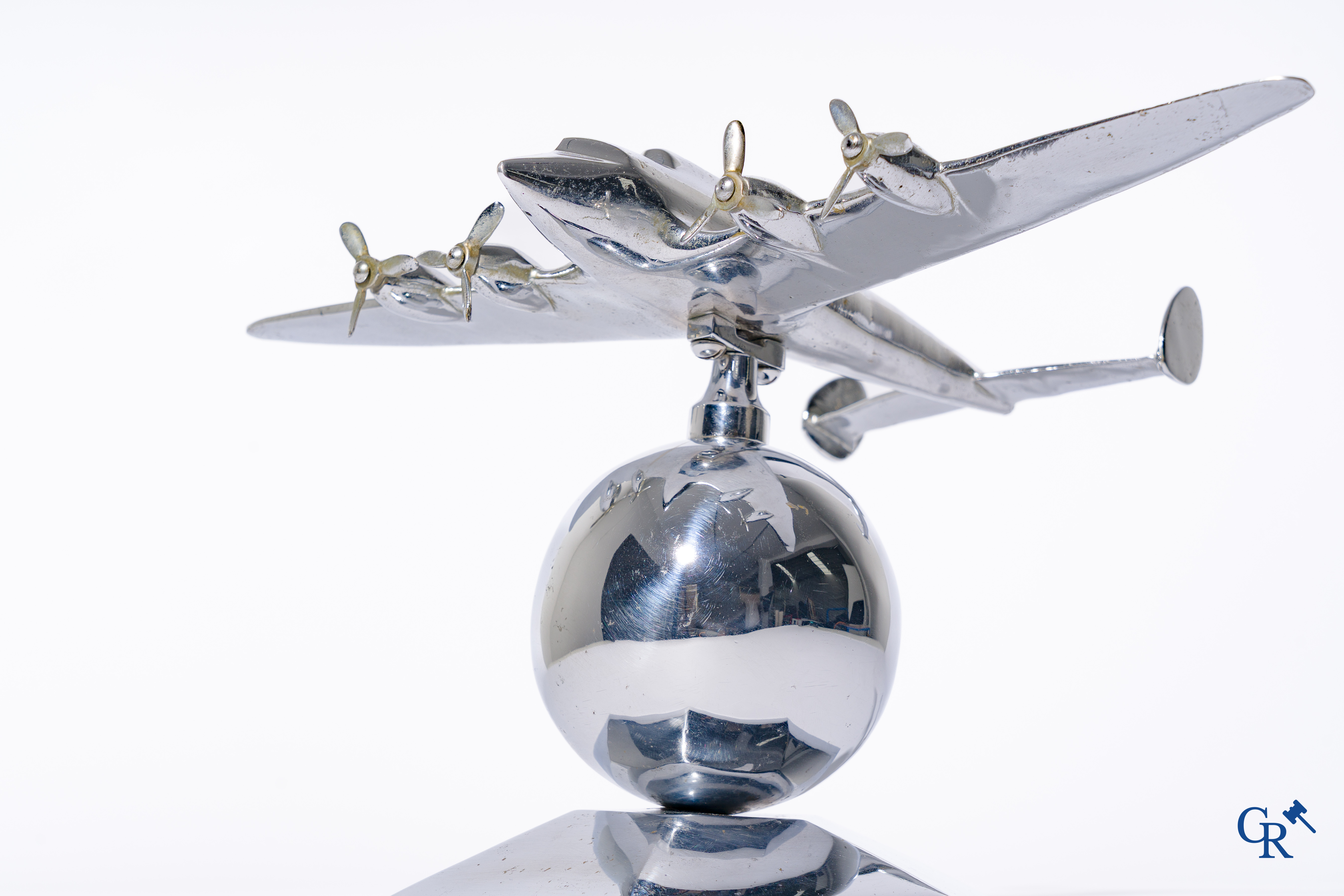 Art Deco, a 1930's desk model of an aircraft in chrome-plated bronze mounted on a stand.