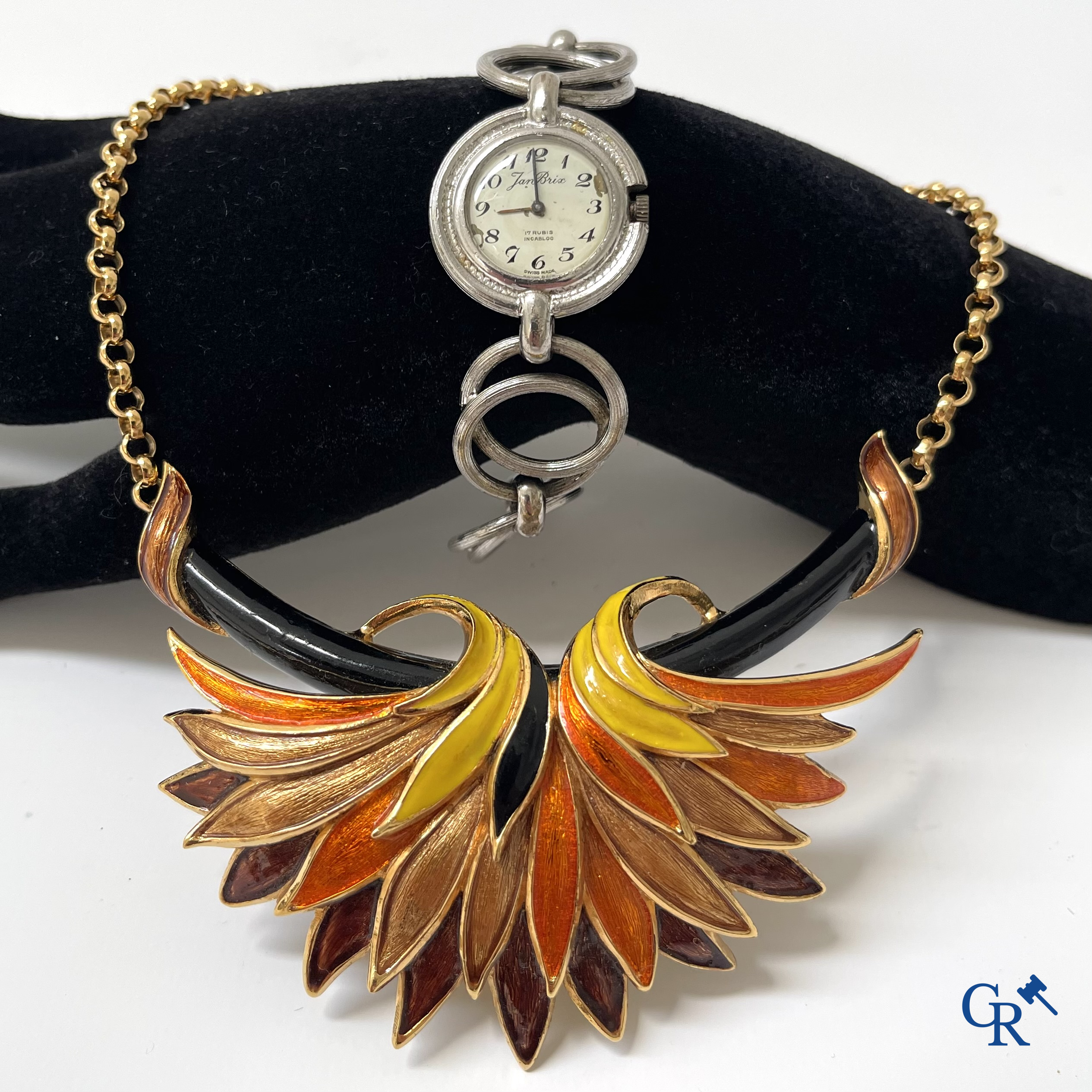 Ladies wristwatch Jan Brix in silver 800°/00, Swiss work and a necklace in enamel and plaque or marked Carven.