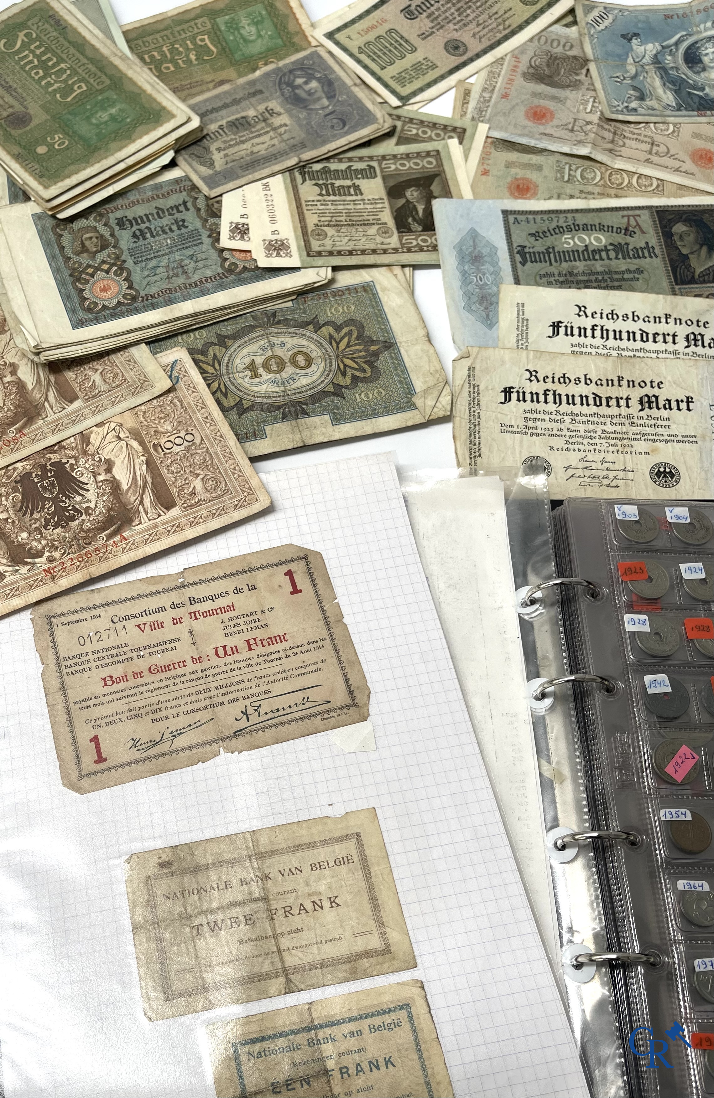 Old coins and banknotes. A large collection of old coins and banknotes. Multiple coins in silver.