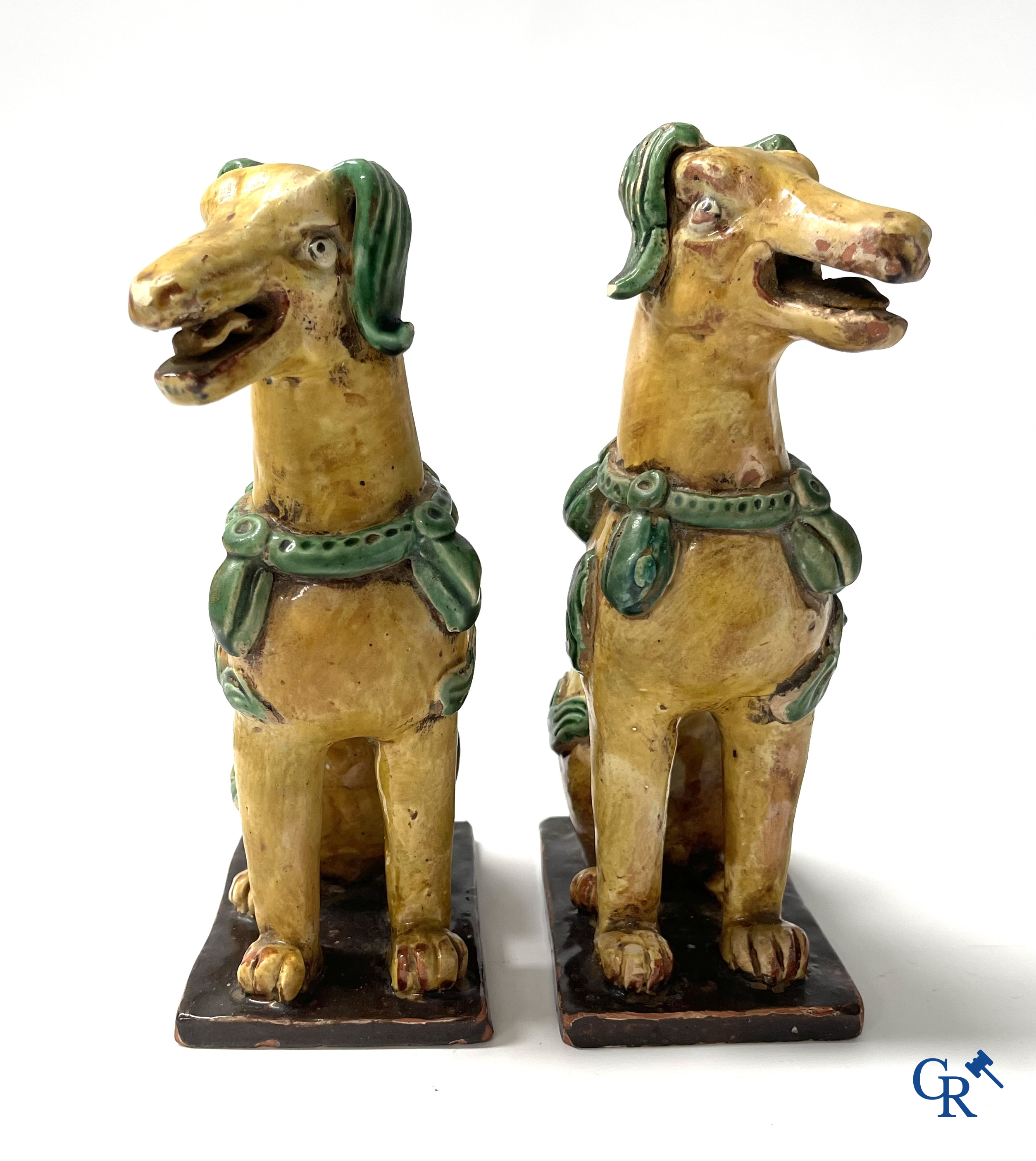Asian Art, Chine. A pair of seated enamelled terra cotta dogs. 18th-19th century.