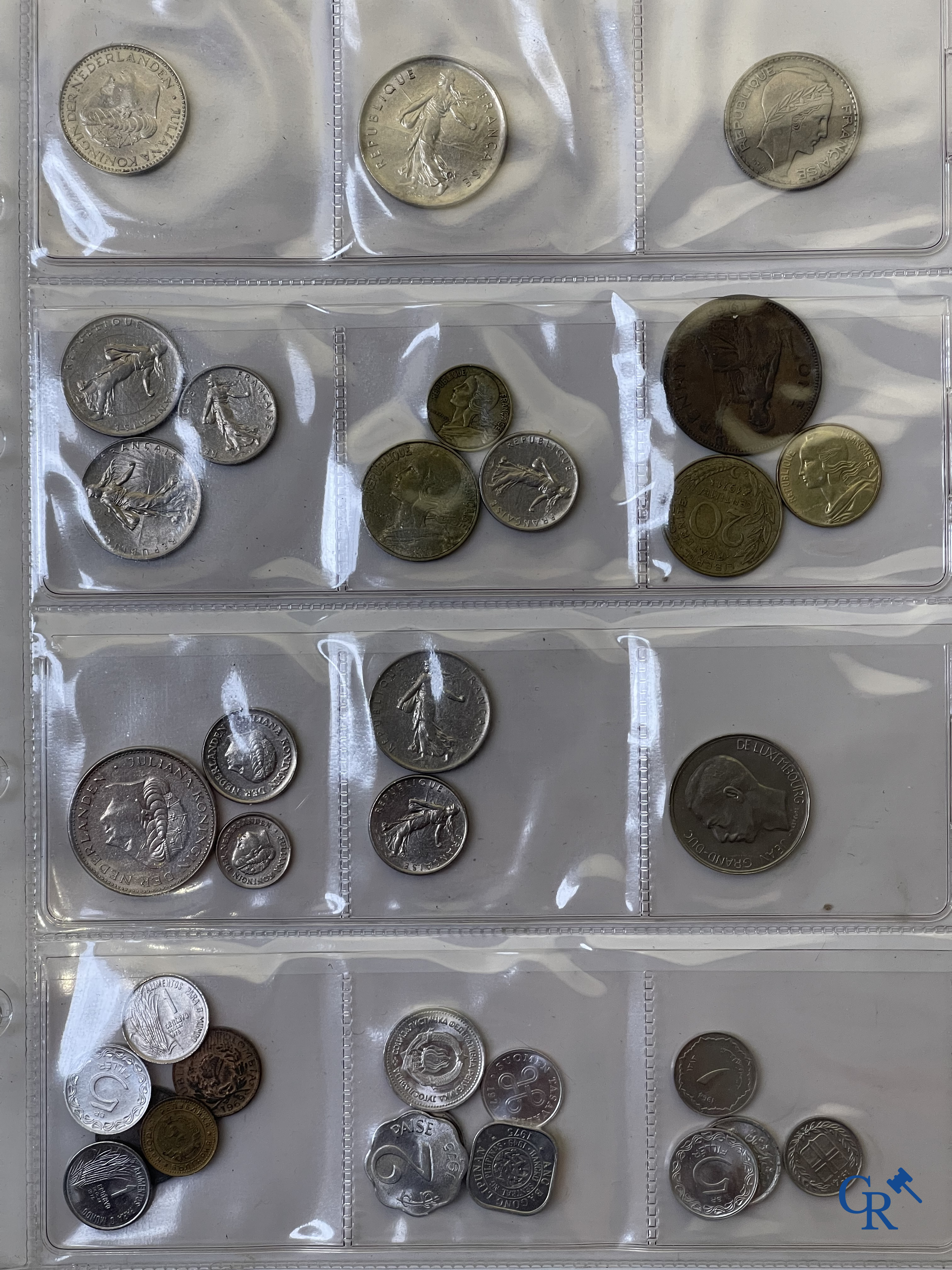 Coins. A folder of collectible coins including silver coins.