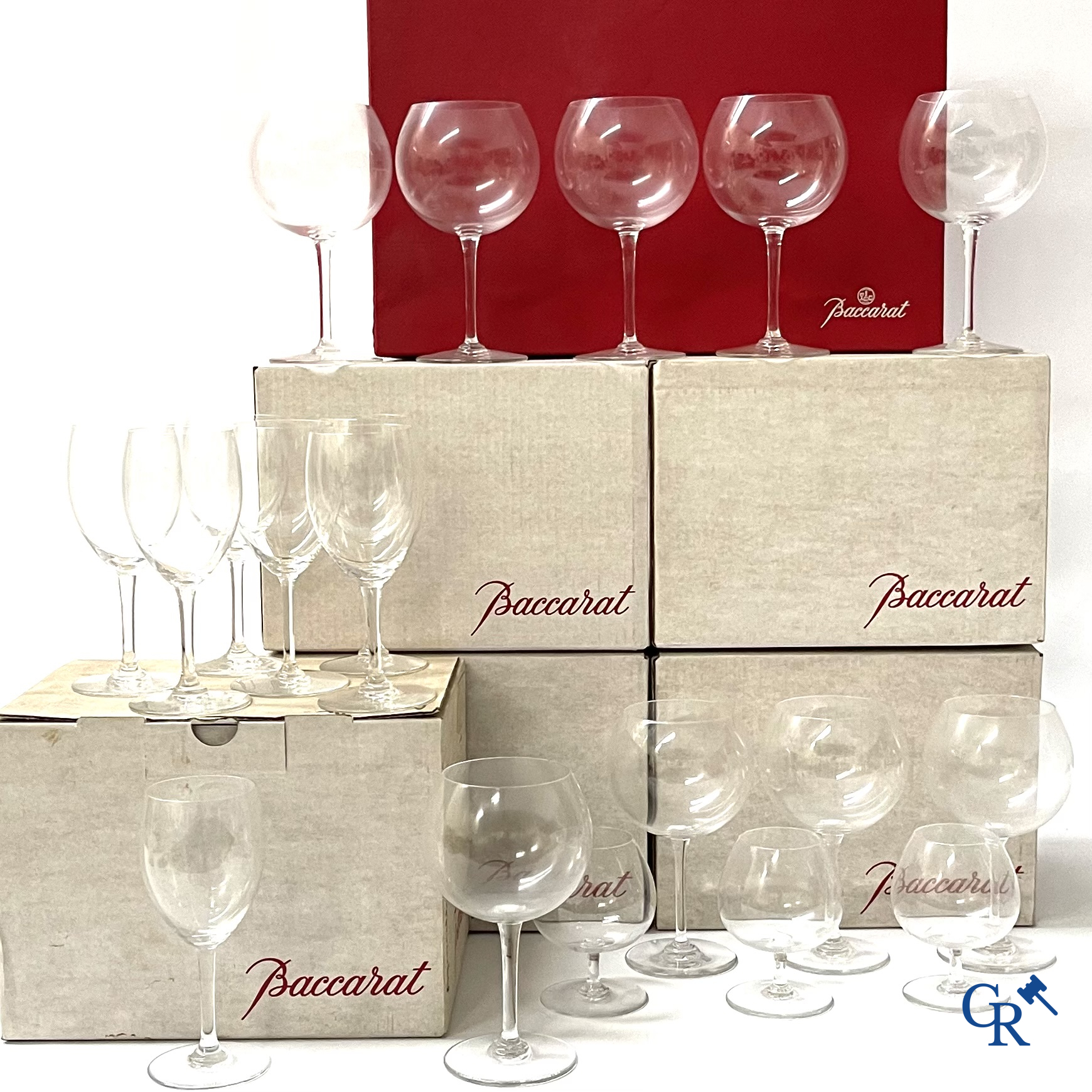 Baccarat France. A large lot (87 pieces) with crystal glasses. Mostly in the original box. Signed.