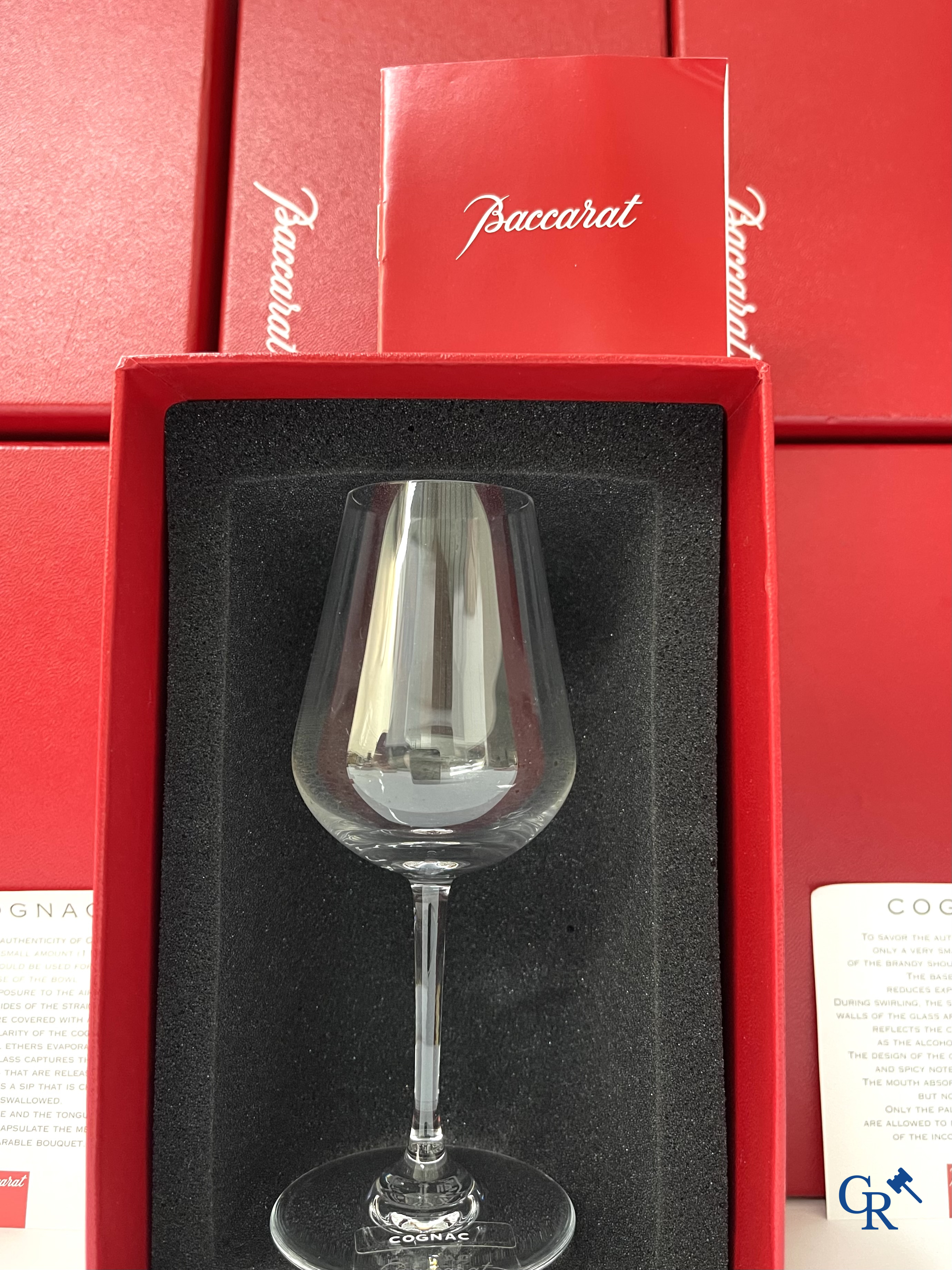 Baccarat. A set of 12 crystal cognac glasses in their original red box. Signed. New condition.