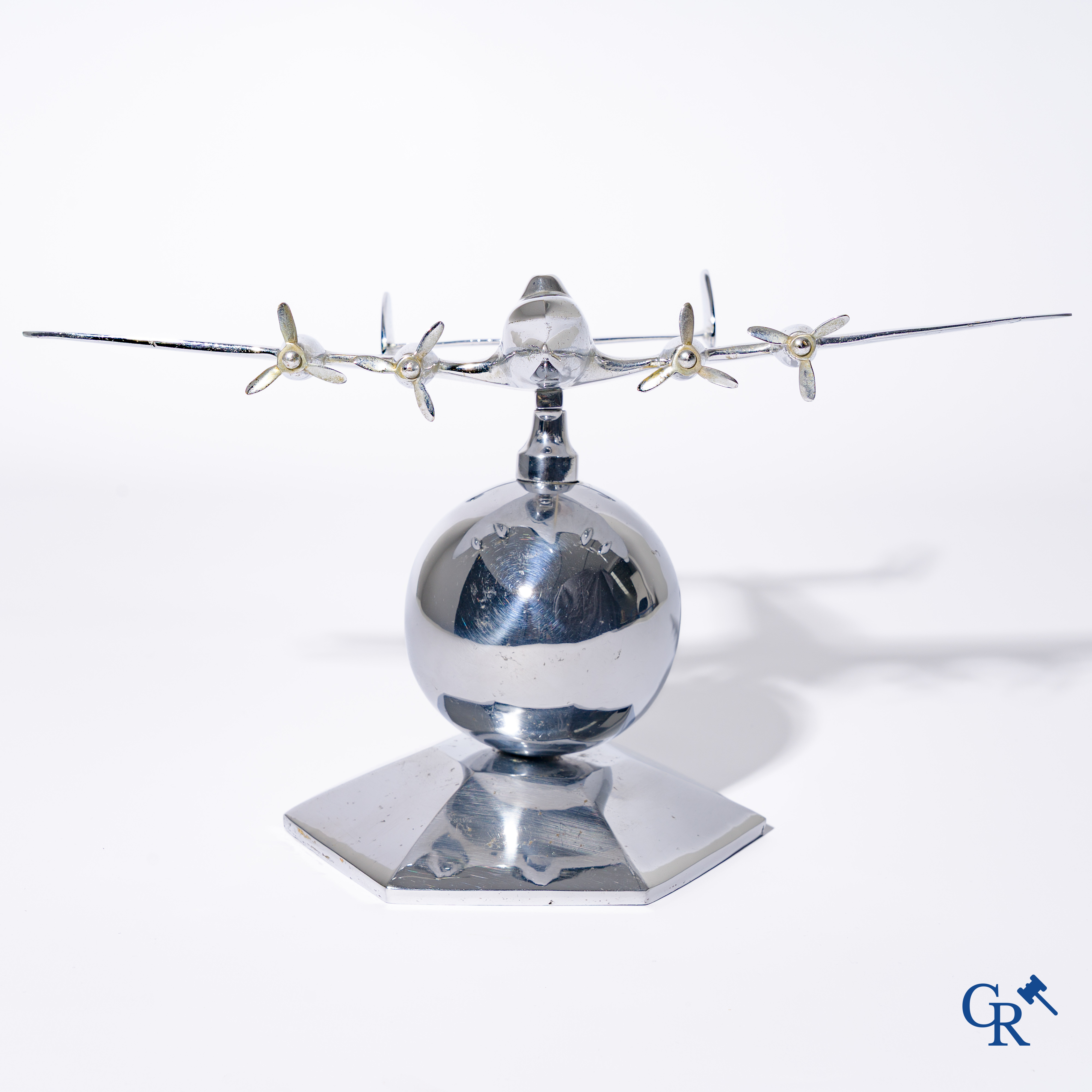 Art Deco, a 1930's desk model of an aircraft in chrome-plated bronze mounted on a stand.