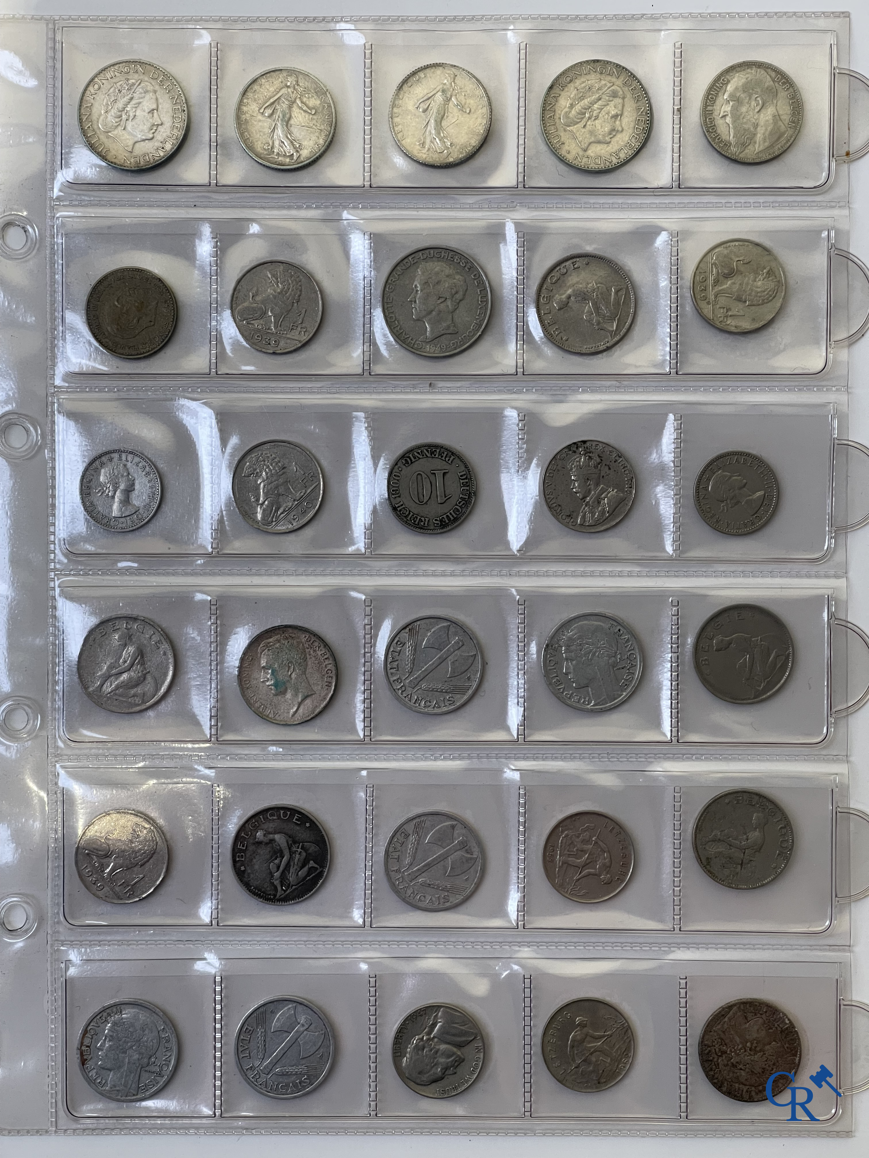 Coins. A folder of collectible coins including silver coins.