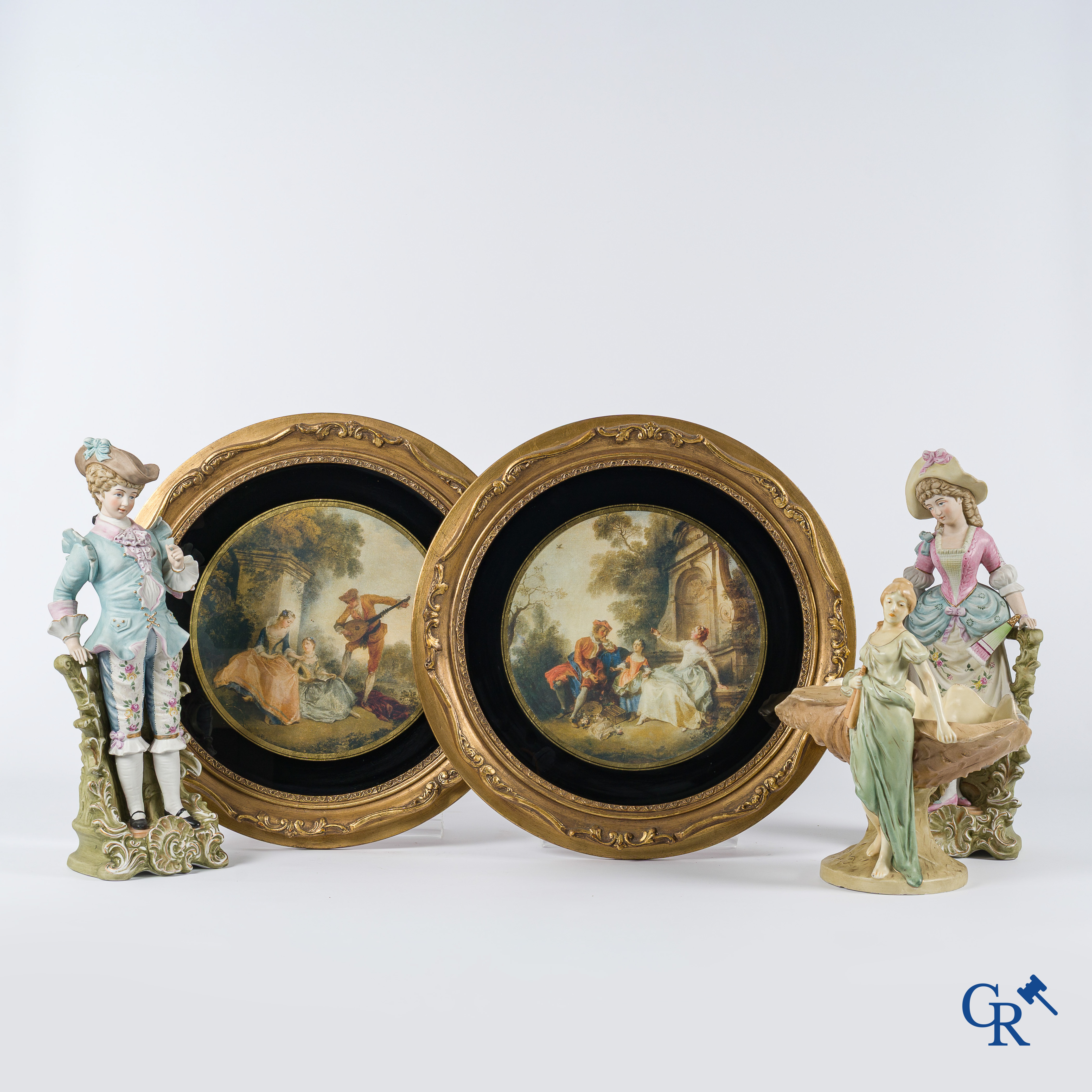Nice lot of brocante consisting of a vide poche in Royal Dux, a pair of biscuit statues and a pair of frames. Around 1920.