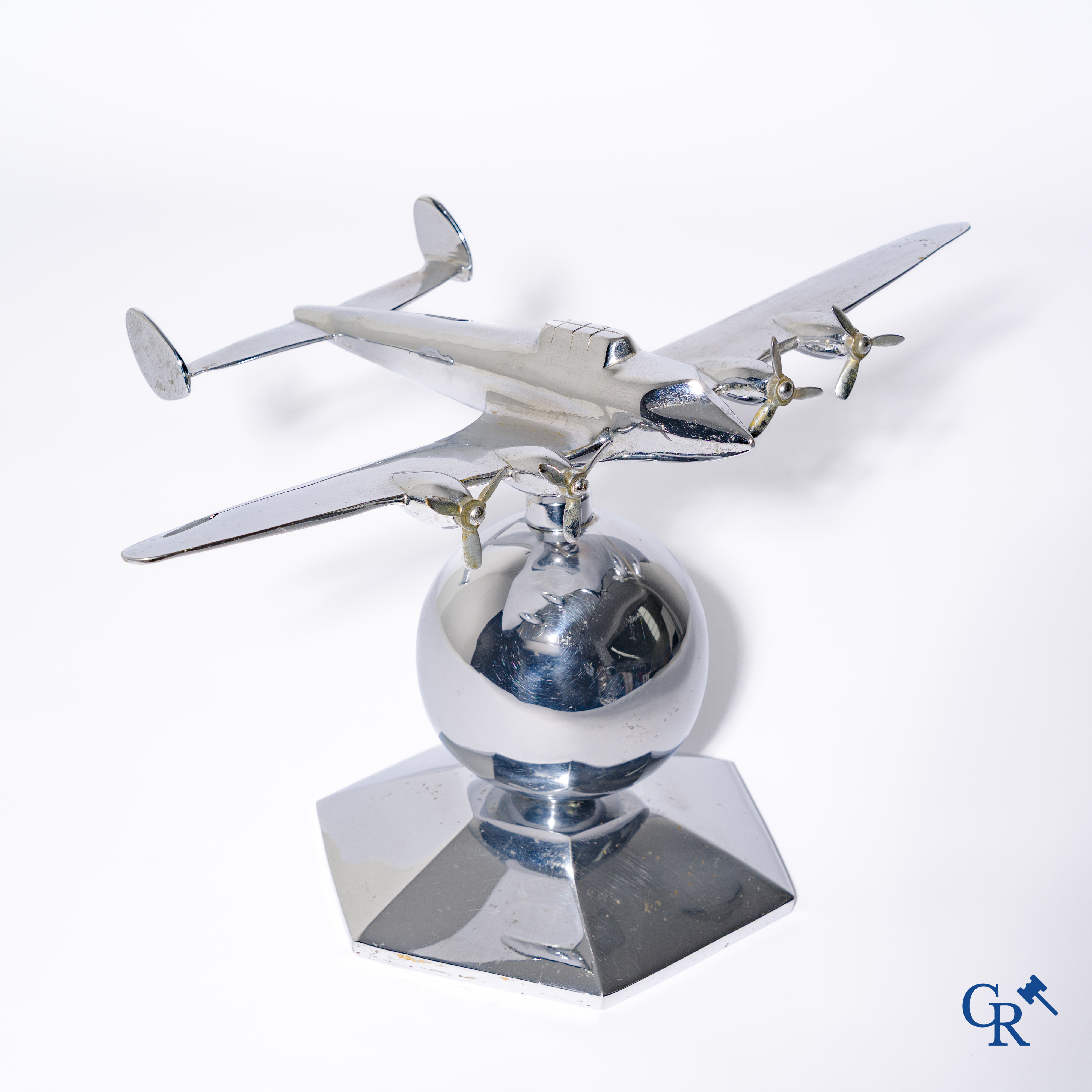 Art Deco, a 1930's desk model of an aircraft in chrome-plated bronze mounted on a stand.