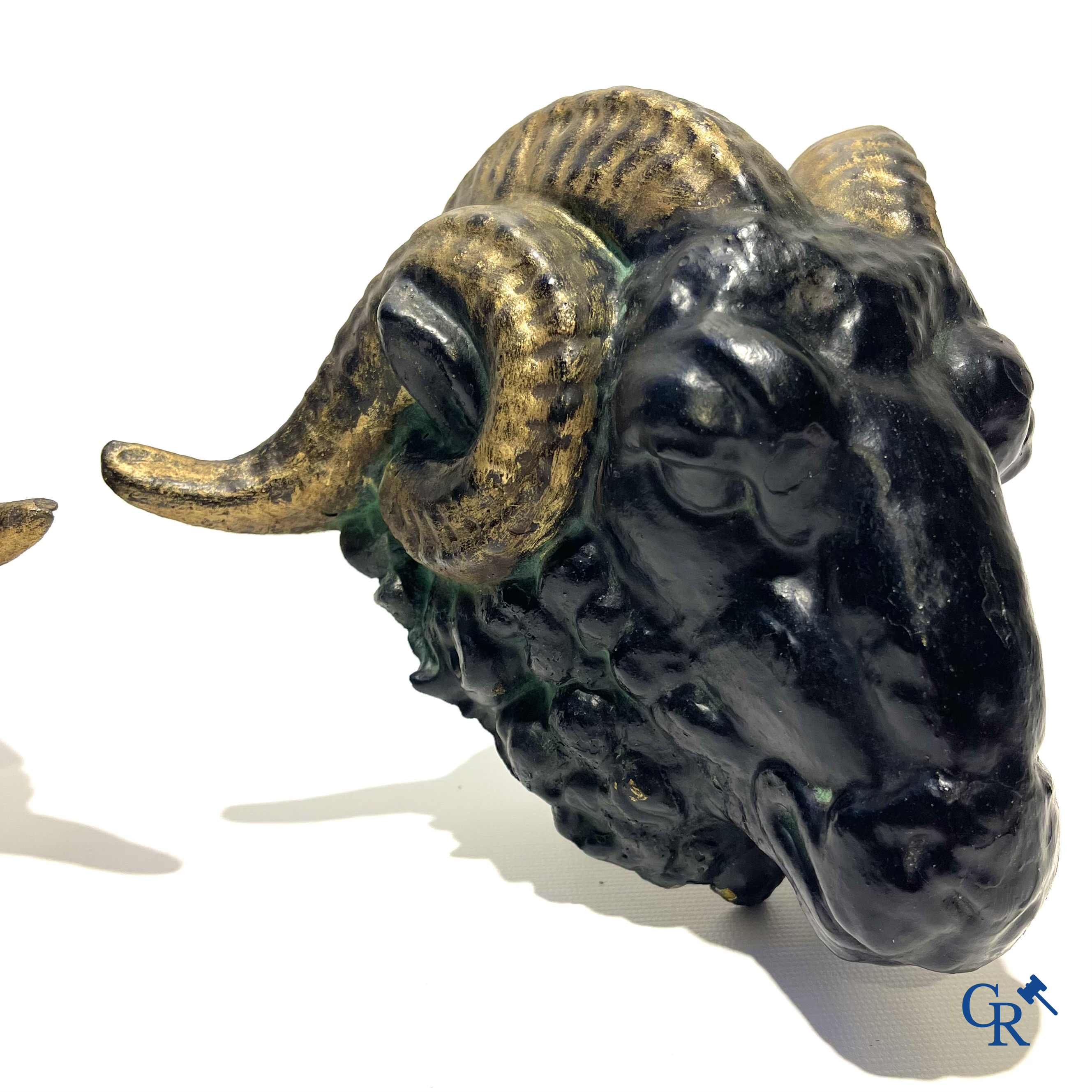 Butchery signboard. Pair of ram heads in zinc serving as façade decoration for a butchery. Circa 1900-1930.