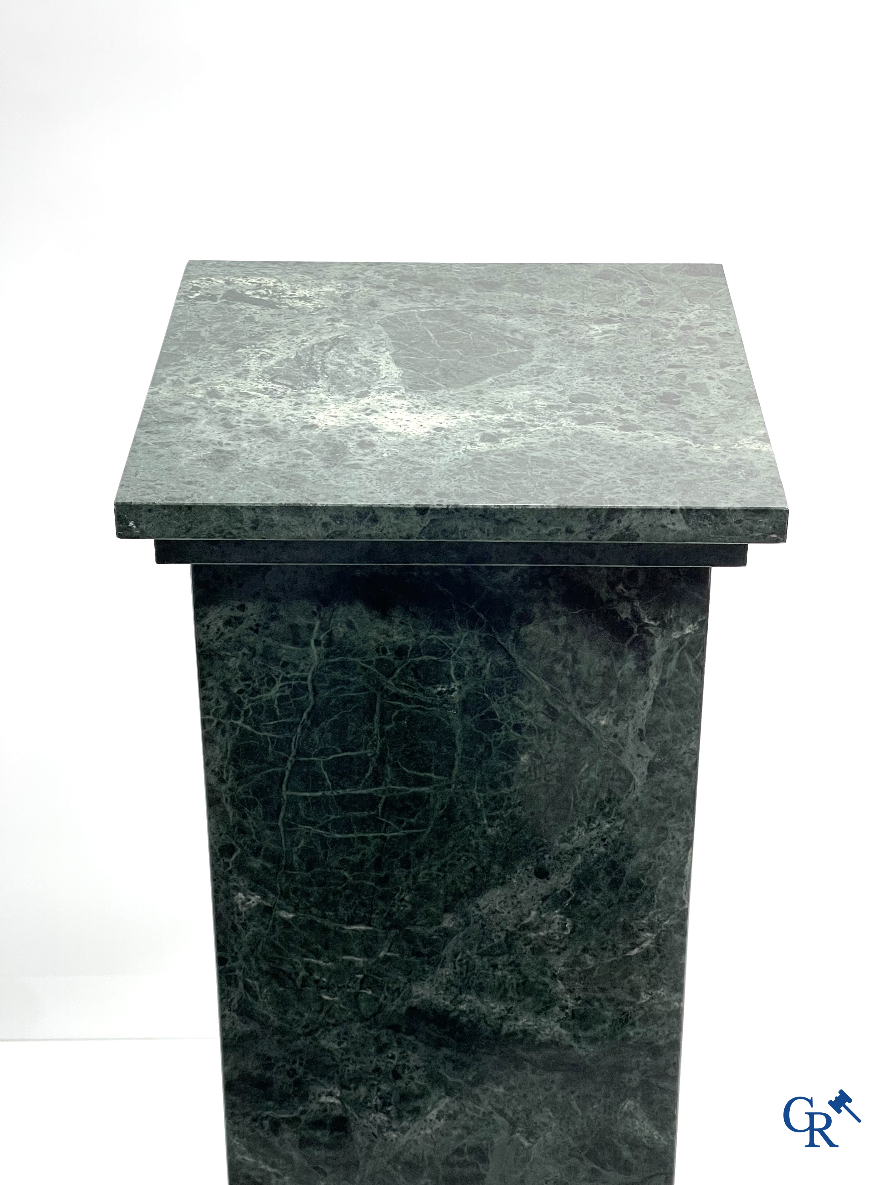 A large pedestal in green marble. 20th century.